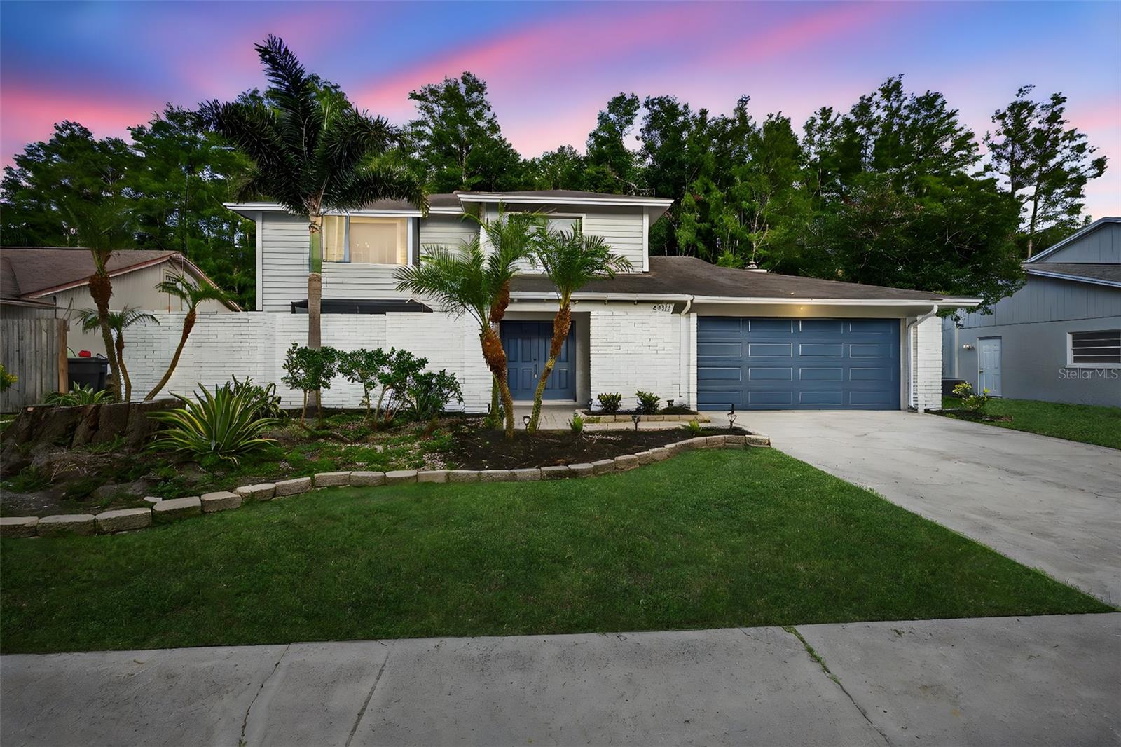 Welcome to this beautiful Fully Renovated 4-bedroom, 2.5-bathroom home located in the sought-after Country Place neighborhood of Tampa. Offering 2,226 square feet of living space on a spacious 0.19-acre lot, this home blends modern upgrades with everyday comfort and style. From the moment you arrive, you’ll notice the impressive curb appeal highlighted by manicured landscaping, palm trees, a charming garden, and a 2-car garage. Inside, brand new ceramic tile flooring flows throughout the home, complementing the bright and open interior. The kitchen has been updated with stainless steel appliances, quartz countertops, and generous cabinet space. The living room features high ceilings and a beautiful fireplace that serves as a warm and inviting focal point. Each bedroom is filled with natural light and includes large windows and ceiling fans for comfort. The bathrooms have been tastefully modernized with sleek vanities and tile-lined showers. A glass sliding door in the living room opens to the covered and screened-in pool deck, creating the perfect space for gatherings, relaxing evenings, or enjoying the sunset. Country Place offers a prime location close to Carrollwood Village Park, top-rated schools, shopping, restaurants, golf courses, downtown Tampa, and nearby Gulf Coast beaches.