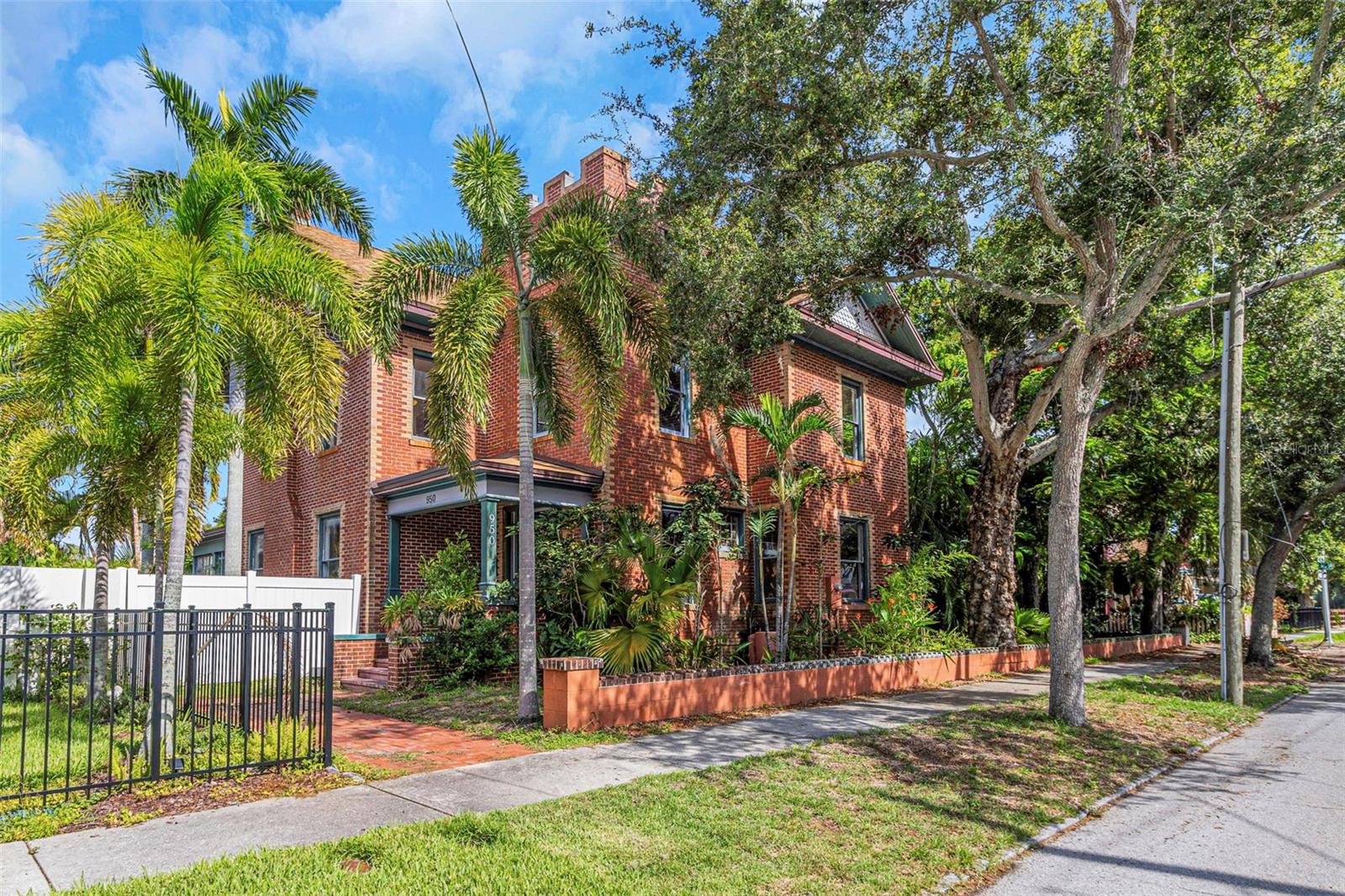 Welcome to the James Henry Residence, a beautifully restored 1905 home that blends historic character with modern comfort. Situated on a double lot in the heart of St. Petersburg, this 3,200-square-foot property features 4 bedrooms plus a loft, 4.5 bathrooms, a pool, wrap-around porch, and a spacious 3-car garage with loft storage—perfect for a future guest suite or ADU.
Recognized as a local historic landmark, this home stands out as one of St. Pete’s earliest and most architecturally significant residences. It’s a unique blend of Queen Anne and Tudor Revival styles, with standout features like a castellated tower, asymmetrical gables, stained glass, decorative brickwork, and original wood flooring. Thoughtfully restored, from the studs up, in 2008, it maintains its vintage charm while offering all new plumbing and electric, a fully updated kitchen, modern appliances, stone countertops, dual AC units, and two tankless water heaters.
The interior features 10 foot ceilings, newly refinished wood floors, vintage lighting, and other period details, and a freshly painted interior throughout. The layout is ideal for entertaining, with a large living room with a wood burning fireplace that flows into an equally spacious dining room with French doors opening to a covered wrap around porch. Enjoy dining al fresco or host poolside gatherings in the private backyard. There is a bedroom and full bath on the main floor.
Upstairs, you will find three generously sized bedrooms, each with their own private bath, a loft perfect for a home office or flex space, and a separate laundry room. The primary suite includes a walk-in closet, garden tub, separate walk-in shower and dual sinks.
Additional highlights include a mudroom with custom built-ins, paved patio, fully fenced yard, ample off-street parking, and a newer roof (2021).
Ideally located in non-flood, non-evacuation zone, just minutes from downtown, I-275, St. Anthony's Hospital, Crescent Lake, public transit, and more, this home offers both convenience and timeless appeal. Call to see today.