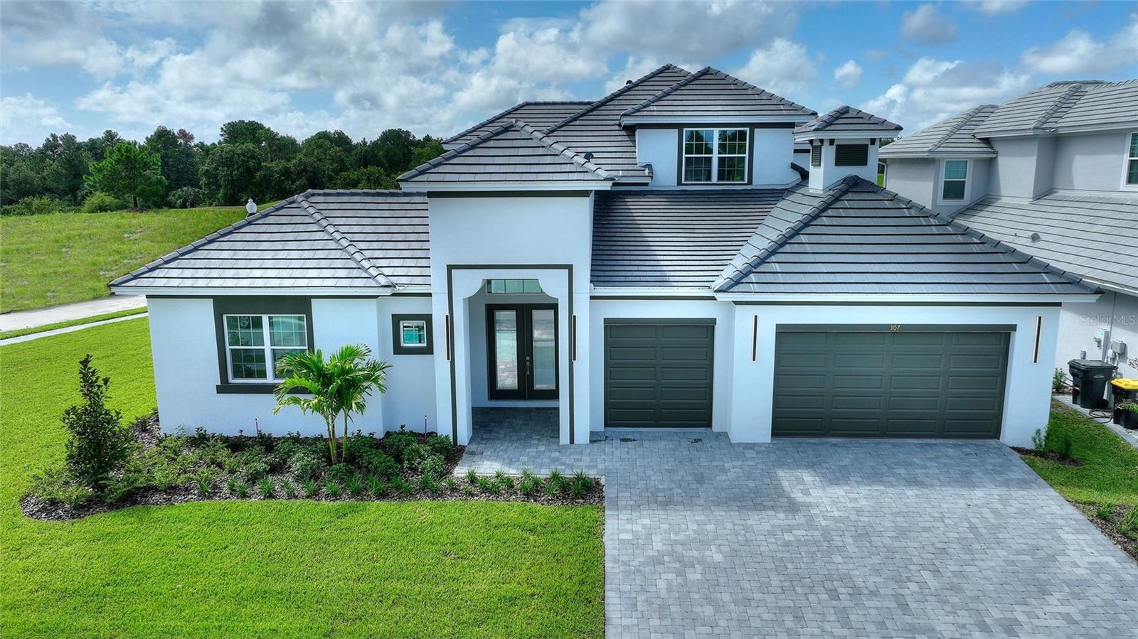 Stunning Luxury Home in Hampton Landing – Providence’s Premier Gated Golf Community Discover refined living in this exceptional corner-lot residence located in Hampton Landing at Providence Golf Community. Perfectly positioned for privacy and panoramic golf course views, this home offers the ideal blend of sophistication, comfort, and functionality. Step into an open-concept floor plan bathed in natural light, with expansive living areas seamlessly flowing together, perfect for entertaining and everyday living. The gourmet kitchen is a chef’s dream, boasting a large quartz island and stainless steel appliances. With four spacious bedrooms, three full bathrooms, and a versatile loft space, there’s room for everyone. The laundry room comes fully equipped with a washer and dryer, and an additional area. Enjoy the rarity of the three-car garages. Your private oasis awaits outside. The custom-designed pool, created for privacy and comfort, and offers a serene retreat. Whether you’re relaxing poolside or hosting guests, this space was made for enjoyment and tranquility. Located in one of Central Florida’s premier gated communities with resort-style amenities, this home offers luxury, comfort, and an unbeatable view. Call Today and schedule your showing!
