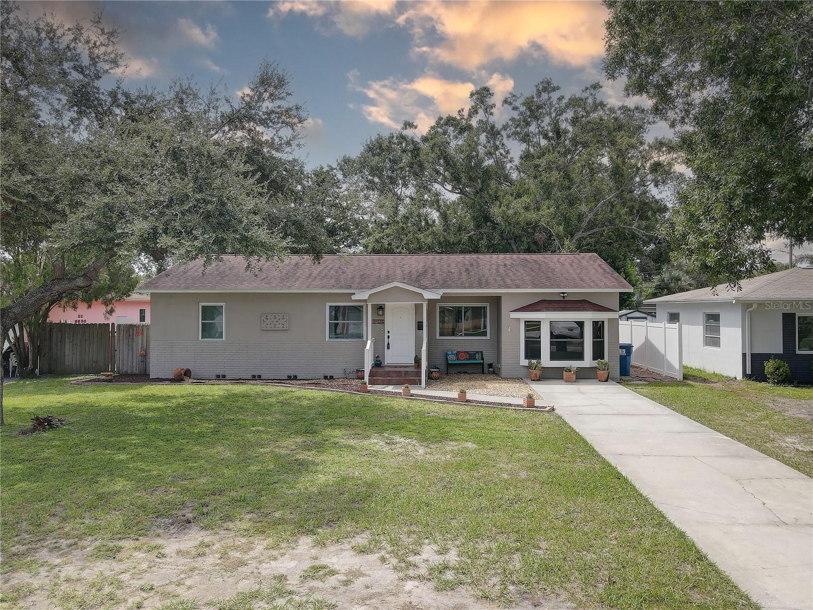 Welcome to 3124 31st Ave N! Get ready to fall in love with this beautifully updated gem — a BLOCK home that’s that has been LOVED and meticulously maintained by the same owner of 30 years. For year round peace of mind, this home is in a NON-FLOOD ZONE & NON-EVACUATION ZONE! From the moment you pull into the driveway, the PRIDE OF OWNERSHIP & CURB APPEAL is obvious. Step through the front door and you will be greeted with warm REAL HARDWOOD flooring throughout the main living space & bedrooms that flows seamlessly throughout the home — offering the perfect blend of elegance and low-maintenance living. NATURAL LIGHT spills through the NEW HURRICANE IMPACT WINDOWS (2018); and the NEWer DOUBLE PANE WINDOWS (2008) in the Kitchen/ Florida room filling the space with an airy & bright energy. Whether you're unwinding in the spacious living room or hosting friends in the dining area, the OPEN layout creates an effortless flow ideal for both relaxing and entertaining. At the heart of it all is the kitchen — equal parts functional and stylish. With ample counter space and cabinets with pull out drawers, this inviting layout makes preparing meals easy. All 3 bedrooms are spacious with ample closet space. The 3rd bedroom is a permitted garage conversion accented with a lovely HURRICANE IMPACT Bay window. This space would also make a perfect Home Office, playroom, exercise room, or a craft room. For added convenience, there is a spacious inside utility room that offers additional storage. Step outside and let your imagination run wild — the fully fenced backyard offers the ultimate canvas. Dreaming of a pool? There’s room. A garden oasis? Absolutely. Or maybe a firepit lounge under the stars? This backyard is ready to become your personal paradise. Additional upgrades include: A/C (2017); Solar Hot Water Heater (2018); IMPACT front door & laundry room door (2024); Roof (2015). This home is 100% MOVE-IN READY! This central St Petersburg location provides easy access to I275 and is close to numerous shopping & dining options. HURRY! This is the one that you can truly call “Home”!