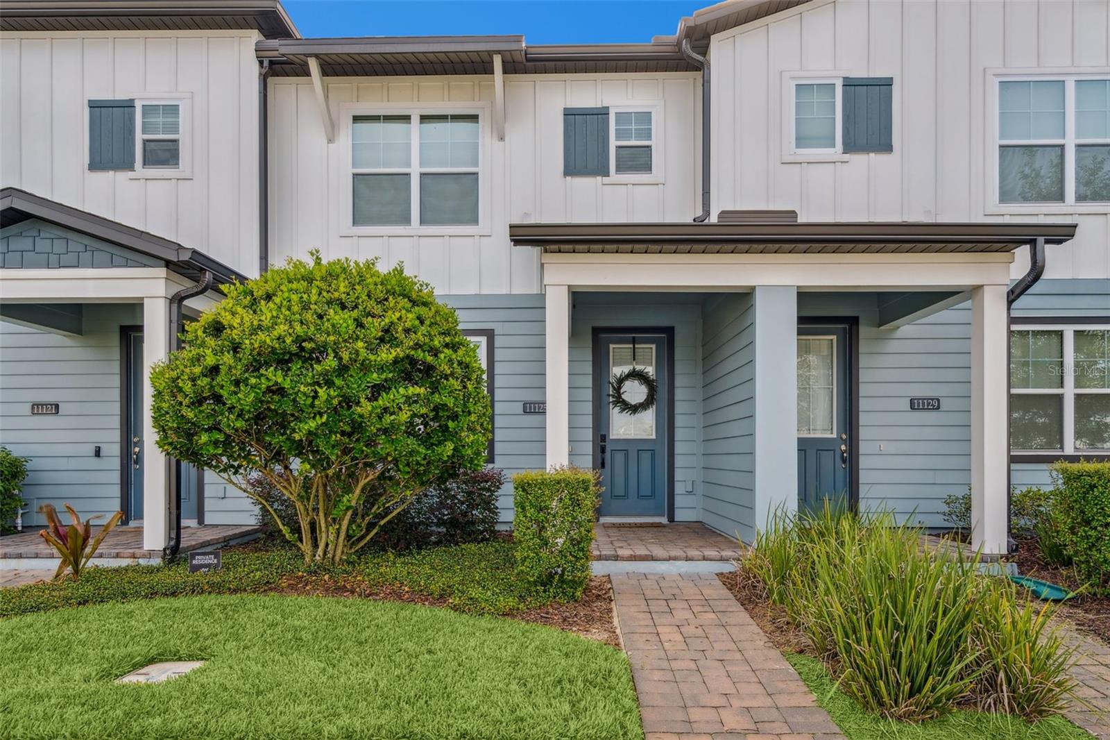 Welcome to 11125 Lime Flower Drive in the highly sought-after Northlake community by Ashton Woods. Just six miles from Walt Disney World, this townhome offers the ultimate convenience, whether you’re headed to the parks, Hamlin Town Center, or Downtown Winter Garden. Everything you love about Central Florida is within easy reach.
Built with modern design in mind, this two-story residence features an open-concept main level that seamlessly connects the kitchen, dining, and living spaces. The kitchen showcases contemporary cabinetry, sleek countertops, and stainless steel appliances. Upstairs, you’ll find 3 spacious bedrooms, including a well-appointed primary suite with a private bath and generous closet space.
Step outside and enjoy low-maintenance living with a private fenced-in patio, while the Northlake community enhances your lifestyle with amenities like a resort-style pool, playground, walking trails, and lawn care. With thoughtful design, unbeatable location, and quick access to major highways, this home is ideal for those seeking comfort and convenience in Winter Garden.
Don’t wait, schedule your showing today and experience the best of Northlake living just minutes from Disney.