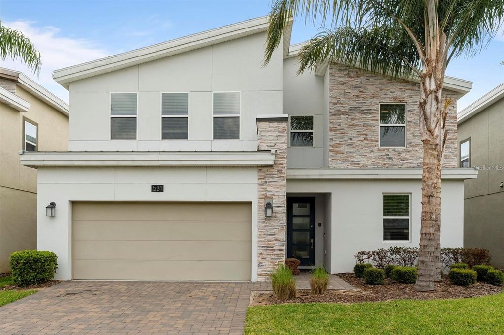 Photo of 581 Pebble Beach Drive, Davenport, FL 33896 (MLS # O6373823)