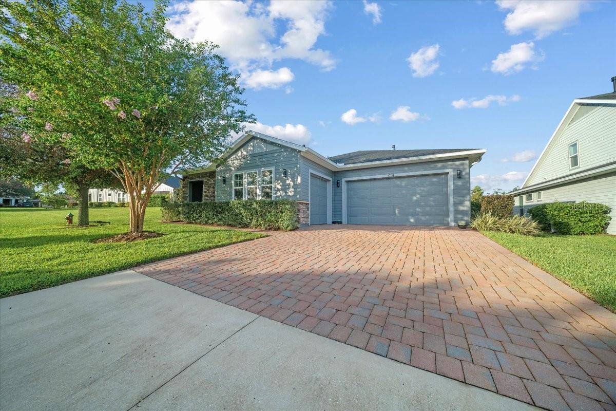 One of a kind customized Celebrate built by Shea – located in the “all ages” side of the community on a quiet, private cul-de-sac lot with beautiful views of open space, trees and golf course. Wood plank style flooring throughout the living spaces. The laundry room/pantry were completely reconfigured and customized to maximize pantry storage and accessibility and updated with custom glass “pantry” door and wood wainscoting and mud room type entry area with bench. Washer and Dryer remain and are 1 year old! While in the kitchen, notice the upgraded GE Monogram gourmet kitchen appliances including 6-burner gas range with hood, double wall ovens – one is Advanteum which doubles as a microwave, 1 year old refrigerator, and amazing storage around the island…………….This home is ready to entertain with custom cabinetry and 2 wine/beverage coolers. After market improvements include the wood accent wall in dining room, foyer and laundry, cabinetry in bathrooms, master bedroom storage cabinets and, master bedroom entry hall cabinetry, windows and room transition areas all trimmed out in wood, upgraded contemporary lighting, ceiling light tray on screened lanai for soft evening ambient lighting, epoxy garage floor, motion sensor lights in garage, laundry, master closet and 2nd bedroom closet and lighted Leviton switches throughout, custom entertainment center in great room. Tray ceilings in primary bedroom and foyer and recently updated exterior coach lights with up and down lighting! AND Eco water softener system with reverse osmosis at kitchen sink and refrigerator and recently added alkaline filter. 2024 exterior of home was completely repainted. This home has been lovingly maintained. Current owners maintained Massey termite bond and expanded service to include attic treatment and bait stations; preventive maintenance bi-annually with SunKool. Plumbed and wired for gas generator, however, generator does not convey……………….Ocala Preserve is a resort lifestyle community and HOA covers lawn and landscape maintenance (cutting, edging, trimming, treating, mulching, fertilizing, irrigation system and water for irrigation), high speed internet, membership in all amenities including indoor and outdoor fitness areas, group fitness classes, 20 miles of dedicated trails for walking and biking, bocce, horseshoe, tennis, pickleball, fishing doc, kayaks, canoes, paddleboat. As a homeowner you also receive discounts in the on-site restaurant, golf course and space for massages, facials, mani-pedi. This area has no CDD assessments.