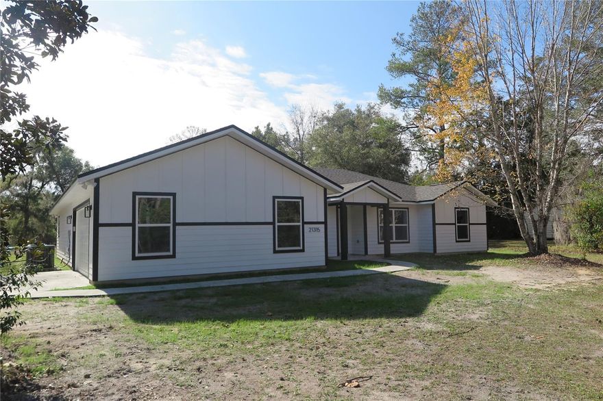 This new construction home is just finished and sits on over 4 acres. There are lots of possibilities here to make the space your own. This open floor plan provides beautiful views from the kitchen and dining area overlooking the wooded backyard. The split layout includes two bedrooms and a full bathroom on one side of the home. The fourth bedroom is positioned just off the main living area and could also function well as a home office or craft room. The large primary suite features a spacious walk-in closet and a curbless shower. A two-car side entry garage connects directly to the utility room, providing quick access from outside and helping keep messes to a minimum. Do not miss the opportunity to see this beauty for yourself! This is a Fannie Mae HomePath.com property. Some photos are virtually staged.