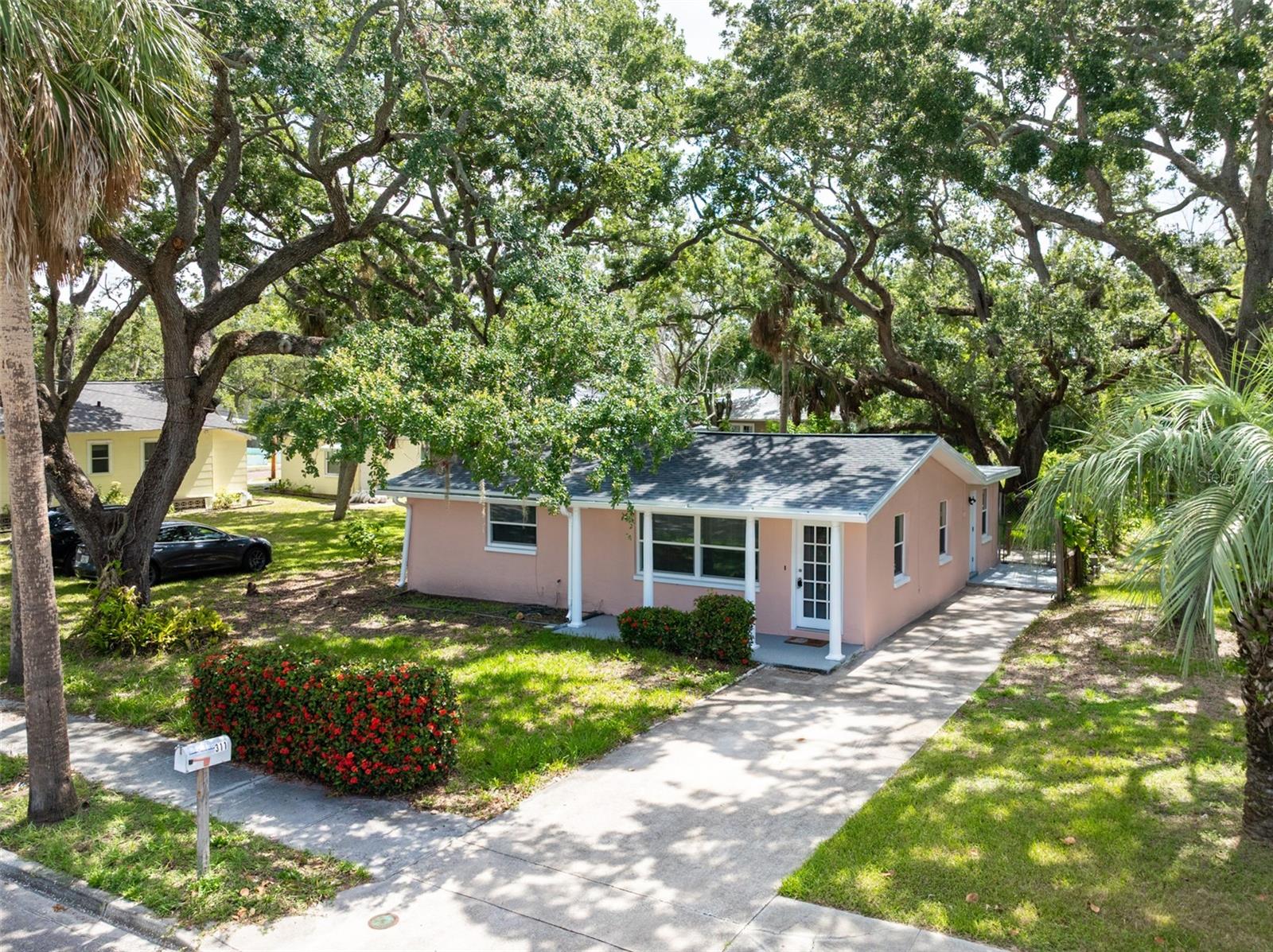 Situated in the highly sought-after "Fruit Bowl" area of Tarpon Springs, this stunning 2-bedroom, 1-bathroom residence is located. This house has been completely renovated, including a new roof, new air conditioning, an updated kitchen with a quartz countertop, white shaker kitchen cabinets, waterproof luxury vinyl flooring throughout the house, updated bathrooms, and more. It is nearly like new construction. You will be in an ideal location to experience the best of this historical town, as it is situated just steps away from the vibrant downtown, famous Sponge Docks, picturesque Spring and Whitcomb Bayous, and the Pinellas Trail. Ideally suited for the construction of your ideal residence, whether you opt to construct a new home or renovate an existing one. This charming lot, which is surrounded by mature trees, will provide you with both privacy and convenience. Iconic Tarpon Springs attractions, such as cultural landmarks, restaurants, and shops, are just around the corner. Easy access to outdoor recreation and tennis courts. This is your opportunity to establish your own oasis in the heart of Tarpon Springs, a community renowned for its vibrant lifestyle and rich history. Live in one of the most desirable neighborhoods in the city and don't miss the chance. Visit this property to experience its immense potential!