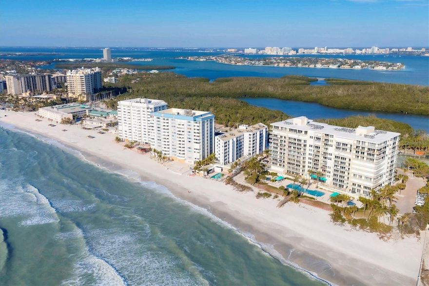 Experience unparalleled luxury in this beautifully updated 3-bedroom, 3-bathroom condo at the highly coveted L Elegance building on Lido Key, offering sweeping views of both the Bay and the Gulf of Mexico.
This exquisite turn-key furnished residence has been meticulously modernized with neutral color palette throughout. The kitchen has been reimagined to enhance functionality and opened to capture more gorgeous views, creating a bright and airy space with ample counter space. European-style cabinetry with a sleek exterior, featuring natural maple interiors and soft-close doors, adds timeless elegance, while the Cambria countertops in varying tones lend an ultra-modern flair. Neutral wood toned tile flooring flows throughout the condo, with plush new carpeting in the bedrooms for added comfort.
No detail has been overlooked: solid core doors, new baseboards, fresh paint, and upgraded hardware throughout. The bathrooms have been completely renovated with the latest design trends, and the primary bath offers a luxurious spa-like retreat with custom closet systems. 
Step outside and prepare to be captivated by the breathtaking views that surround you. Enjoy both sunrise and sunset from your expansive balconies—one offering panoramic views of the downtown skyline and sparkling Bay, and the other providing a front-row seat to the mesmerizing Gulf sunsets. Whether you’re relaxing on your terrace or watching the lights of downtown illuminate the evening sky, this residence delivers a front-row view of the best of Lido Key.
Designed with privacy in mind,  the condo features a thoughtful floorplan that ensures each bedroom enjoys its own peaceful retreat. The spacious laundry room is equipped with a sink, making it easy to manage wet bathing suits and towels after a day at the pool and beach.
In addition to its unparalleled views and exquisite design, the L ‘Elegance building offers a wealth of world-class amenities to enhance your lifestyle. Dive into relaxation with the expansive lap pool, hot tub, and wading pool. Stay active in the state-of-the-art fitness center, complete with separate men’s and women’s locker rooms featuring saunas. For tennis enthusiasts, L Elegance is home to the only two Har-Tru tennis courts on Lido Key. The building also boasts a card and billiards room, 24/7 gated security, and underground parking for convenience and peace of mind.
Live the dream in this exclusive rare gem offering a sophisticated and tranquil haven with stunning views. Just a short stroll away, explore the iconic St. Armands Circle, a vibrant shopping and dining destination nestled in a beautiful park-like setting. Enjoy art shows and lively events throughout the year, adding a touch of culture and excitement to your calendar.
Only a short drive across the bridge, the heart of downtown Sarasota awaits, offering more top-tier restaurants, boutique shopping, and entertainment.
Your perfect paradise is calling—experience the ultimate in exceptional living at L Elegance.