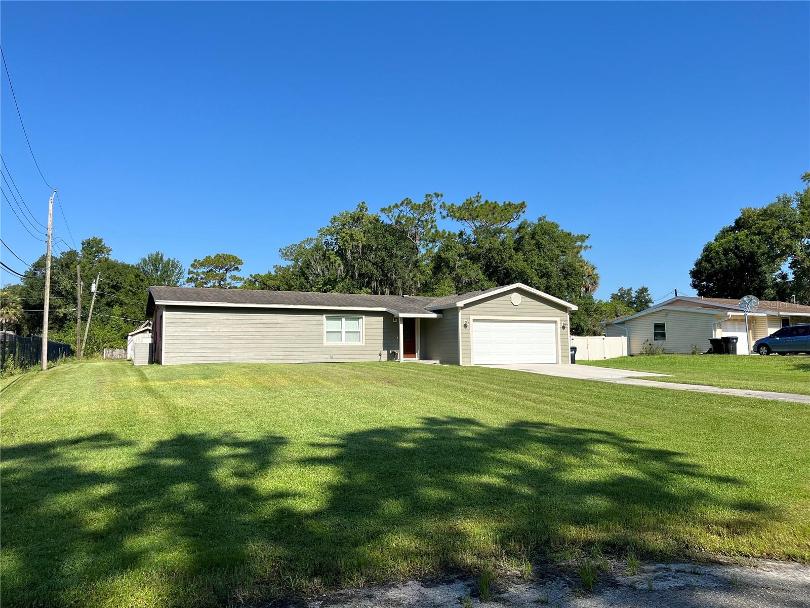 RARE FIND in East Orange County. Here's your opportunity to own a spacious 2 bedroom, 2 bathroom home set on a generous HALF AN ACRE lot with NO HOA restrictions! Whether you're looking for your next residence, a rental investment, or a renovation project, this property offers endless potential. The homeowners have taken meticulous care of this home as you will see walking through the beautiful front door.
Inside, you’ll find a comfortable layout with two well-sized bedrooms and two full bathrooms. The kitchen is spacious, with gorgeous granite countertops, SS Appliances and plenty of cabinet space. Both bathrooms have been upgraded, with the primary bath boasting gorgeous tile and a huge walk-in shower. This home is ready for your personal touch and can be easily renovated to suit your style or upgraded for added value. With solid bones and great natural light, it's the perfect canvas for your vision.
Enjoy the peace and PRIVACY of the large lot. There is already a concrete pad poured along the entire length of the home so bring your ideas. You can easily add on to the home or build the pool of your dreams and screen in the patio. As a bonus, there are 2 sheds that will be yours when you close. There is plenty of room! Whatever you can dream, it can happen. So bring all your toys, RV, or boat—there’s space for it all and no HOA to worry about!
KNOLLWOOD PARK is a quiet, established neighborhood and this home is at the end of the paved street. Nice!! PRIVATE yet still convenient to all the shopping, dining, banking and entertainment you will desire. S.R.50 (East Colonial Dr.) 408, Alafaya Trail are all just a stone's throw away. What are you waiting for- Unlock the potential of this hidden gem - SCHEDULE YOUR SHOWING TODAY! Stay tuned, professional photos and drone videos are coming soon!