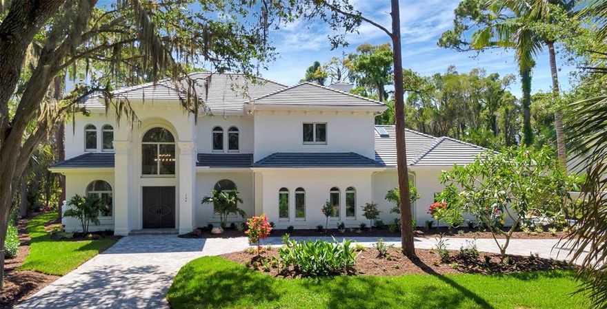 **STRIKING, MOVE-IN READY, CONTEMPORARY, FULLY-RENOVATED ESTATE** found behind the gates of the coveted OAKS-BAYSIDE Country Club Neighborhood on Sarasota Bay waters… entails 5 Beds + 6 Full & 2 Half Baths + ELEVATOR + 3-Car Oversized Garage.  Countless 2022 UPGRADES include New Roof, A/C, “Diamond Brite” Pool Surface & Pool Equipment and premium Travertine decking, Gorgeous Modern Kitchen and Baths featuring Calcutta Quartz counters, contemporary light fixtures, LED lighting throughout, luxury vinyl plank flooring and So Much MORE!  Comprehensive LIST OF UPGRADES is available upon request.  The Spacious Master Suite includes an impressive master bath with custom tiled shower, free-standing tub and SAUNA!  This home features spectacular curb appeal and is situated on a Cul De Sac, newly Landscaped lot of over 1/3 acres with newly Pavered Circular Driveway, New lighting and Irrigation systems, etc.  Flood Insurance is NOT required (Flood Zone X).  The nearby, Private Dock on the Intracoastal Waterway is a cherished amenity of the Oaks-Bayside residents. THE OAKS is a distinguished country club community which boasts many accolades including: Platinum Club of America, Emerald Club of the World and Elite Distinguished Club of the World - where amenities include two, 18-hole championship GOLF courses, award-winning TENNIS program with 12 Har-Tru Hydro-Grid tennis courts, 4 Pickleball Courts, state-of-the-art FITNESS center and junior Olympic, heated community SWIMMING POOL. The Oaks is just minutes from nationally ranked Pine View School, the Legacy Bike Trail, area Beaches and all that Gulf Coast living has to offer. Membership is required and available. **MUST SEE**