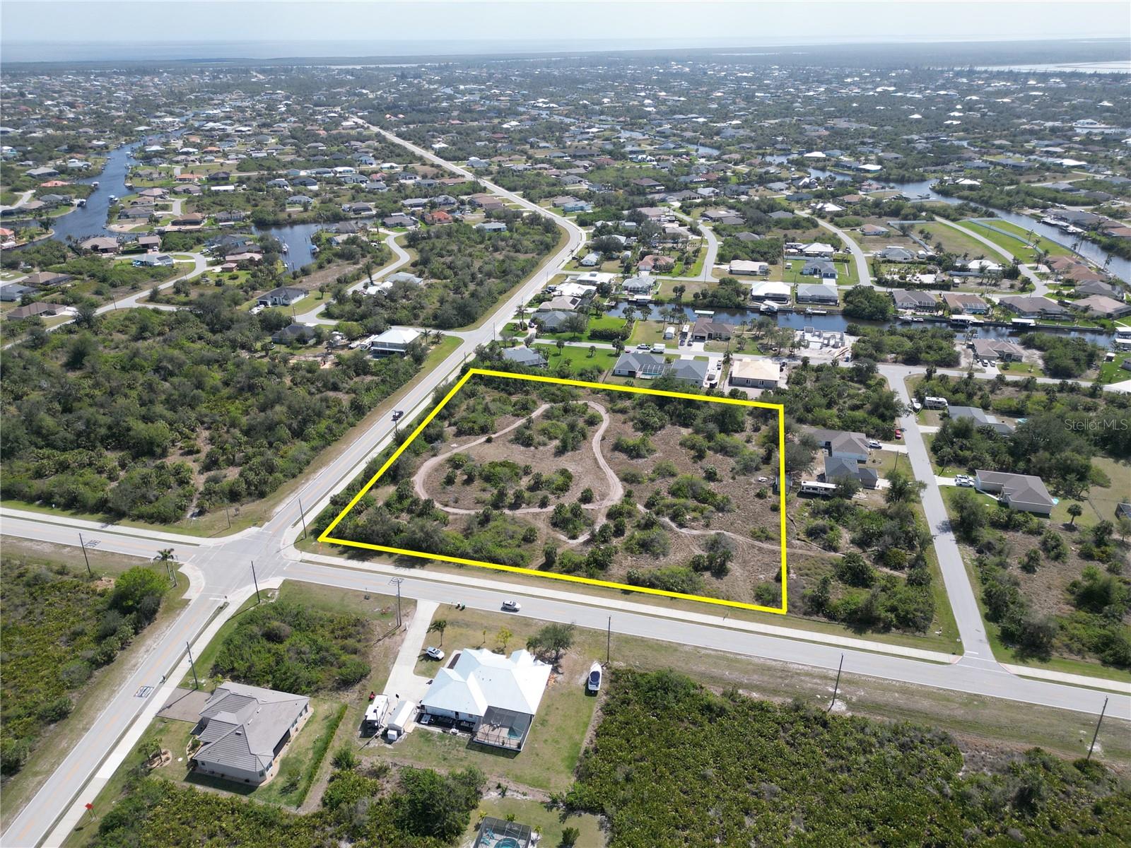 4.1 Acres For Sale - Zoned CG - Commercial General. Water, Sewer and Electric are all run upto the property making this prime for development. Commercial General Zoning allows for many uses which include Retail Services, Restaurants, Bars / Lounge, Houses of Worship, Business & Professional Services, Banks, Hotels, Gas, Garden Center, Child Care, Animal Hospital, Private Clubs plus many other uses. The subject property is in the center of South Gulf Cove that consists of over 14,000 homesites with approximately 5,000 existing homes. New Home Construction has been booming over the past several years creating a huge demand for commercial services. Being located on the corner of Ingraham Blvd & Calumet Blvd gives you a strong traffic count with high visibility. Secure your piece of Paradise today while investing in your future.