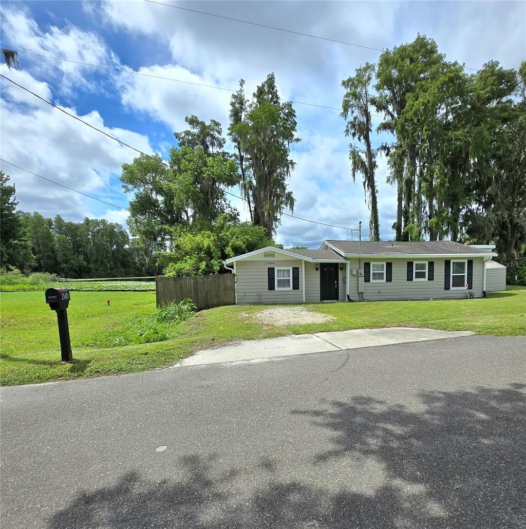 Photo of 21400 Lake Sharon Drive, Land O Lakes, FL 34638 (MLS # TB8416068)