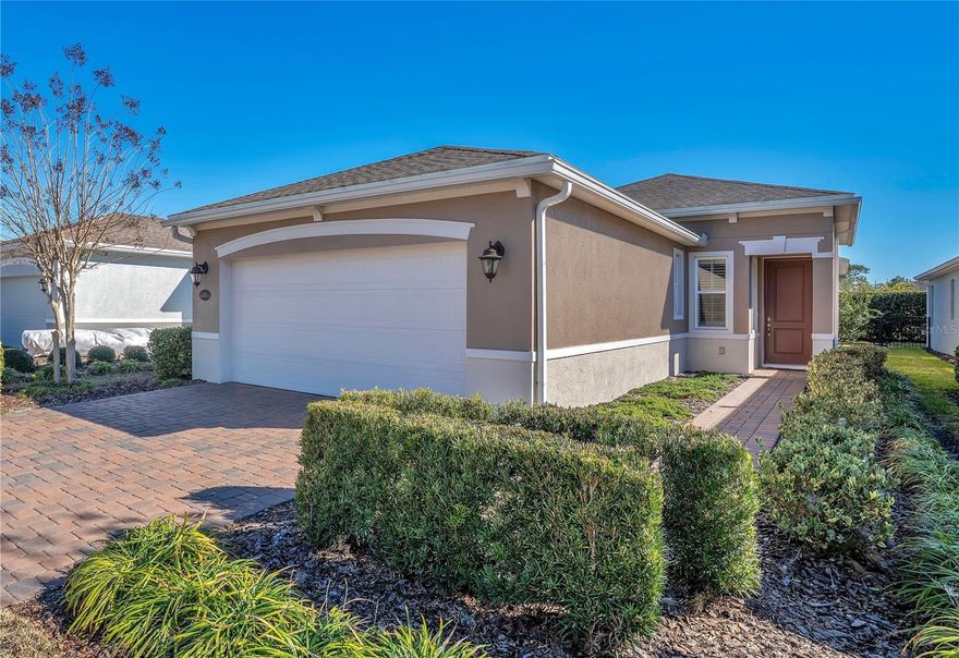 Under contract-accepting backup offers. Welcome to low-maintenance living in this well-designed patio home, ideally situated toward the back of a desirable 55+ community for a quieter, more peaceful setting AWAY FROM through traffic.  Resort-style living awaits in the gated, guard-attended Victoria Gardens community. Qualified buyers can TAKE ADVANTAGE of a 1% interest rate buy-down for the first year when using the seller’s preferred lender. That lender will pay to temporarily reduce your rate for year one, PLUS credit your appraisal fee back at closing, a $500 value.  
Plantation shutters throughout provide a clean, classic look and excellent light control, allowing you to maintain privacy without sacrificing natural light. The kitchen features a walk-in pantry, granite countertops, decorative backsplash and generous counter space. A large kitchen window offers the perfect spot for a rolling island cart to add even more workspace. 
No wasted space.  The combined living and dining areas are highlighted by a single tray ceiling that visually unites the space. Nine-foot ceilings help with efficient heating and cooling while creating an open, comfortable feel. Laminate flooring throughout makes cleanup easy and is ideal for allergy-conscious buyers.
The primary bedroom suite features a decorative tray ceiling, two walk-in closets, and an en suite bath with double vanities and a walk-in shower. 
Open up your living space to the outdoors with beautiful French doors that lead to a screened porch with pavers that overlook a privacy hedge backdrop for a peaceful view.  The backyard offers space for pets, and approved fence option.  Keep laundry and household tasks out of sight and out of the way with a separate laundry room. An important convenience many buyers appreciate.  Additional features include a gas water heater, with gas options available for the range and dryer. Insurance savings may apply with a fire hydrant located next to the property and a fire station approximately one mile away.  Enjoy true lock-and-leave living with lawn care included. HOA dues cover mowing, trimming, edging, weed control, fertilize, mulch, lawn irrigation, cable TV, and internet.
Community amenities include a clubhouse, restaurant, poolside dining area, spacious business center, multi-purpose rooms, resort-style pool, pergolas, separate hot tub area, tennis courts, pickleball courts, and gated security. Conveniently located near Victoria Park Village Center with medical offices, pizzeria, ice cream shop, City Wine & Cigar  and easy access to I-4.  Low-maintenance living, a quiet location, and a layout that simply makes sense—this patio home checks all the right boxes for easy 55+ living.