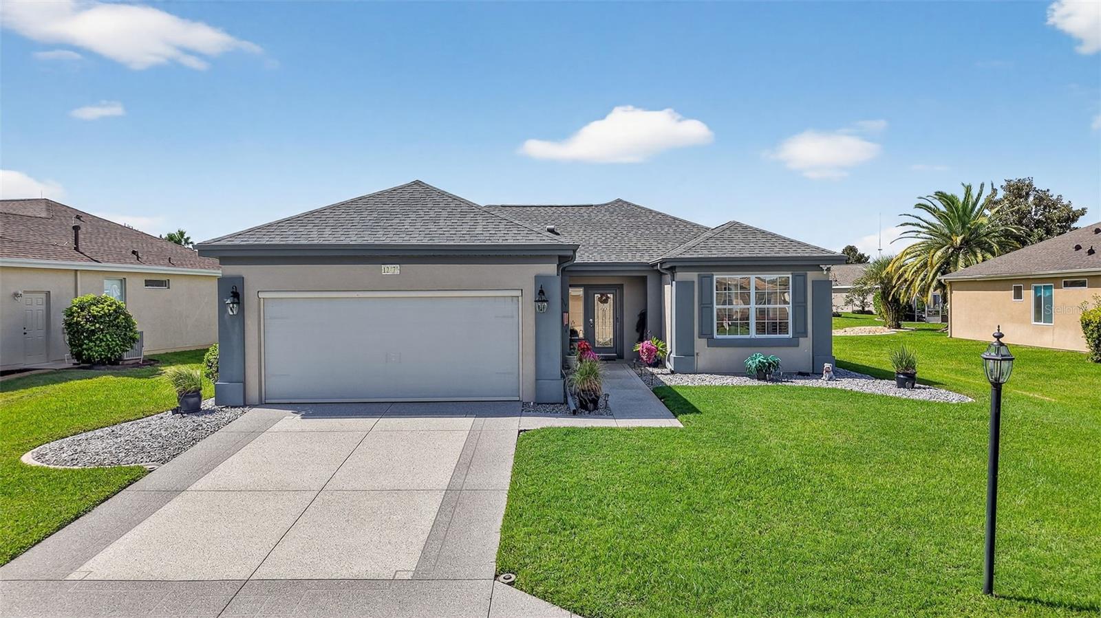 This TURNKEY updated, furnished 2-bedroom, 2-bathroom home is truly inviting. As you approach the residence, you will appreciate the mature landscaping, epoxy driveway and walkway, as well as the landscape curbing complemented by rock beds. Upon entering the home, you will be captivated by its modern charm, highlighted by the glass front door leading to a tiled entryway. The living room is filled with natural light from the windows, a solar tube, and a fan/light combination, connecting to the updated kitchen. This kitchen boasts granite countertops, newer stainless-steel appliances, recessed cabinets, and a pantry. The dining area provides an excellent space for entertaining guests. The owner's suite is a welcoming retreat featuring LVP flooring, a walk-in closet, and an ensuite bathroom equipped with custom mirrors, double sinks, and glass doors leading to a step-in shower with a seat. The guest bedroom also offers a spacious layout with LVP flooring and a fan/light combination with convenient access to updated guest bathroom. The glass enclosed lanai, complete with air conditioning, serves as a versatile space for various uses. The backyard is equally impressive, featuring a pavered sitting area adorned with an umbrella and outdoor furniture, creating an ideal setting for relaxation and enjoyment. Several additional enhancements have been made, including crown molding, plantation shutters, an upgraded air conditioning controller, a new irrigation system that provides control over the B Hive sprinkler, and the installation of more economical sprinkler heads. Del Webb Spruce Creek is a gated 55+ community offering an active lifestyle. Community offers clubhouse with recreation including a swimming pool, fitness room, billiards, pickleball courts, softball clubs, and more. Whether you’re looking for a winter retreat or a home to enjoy year-round, this could be the perfect fit! Quick close possible—ask how to make this home yours today!