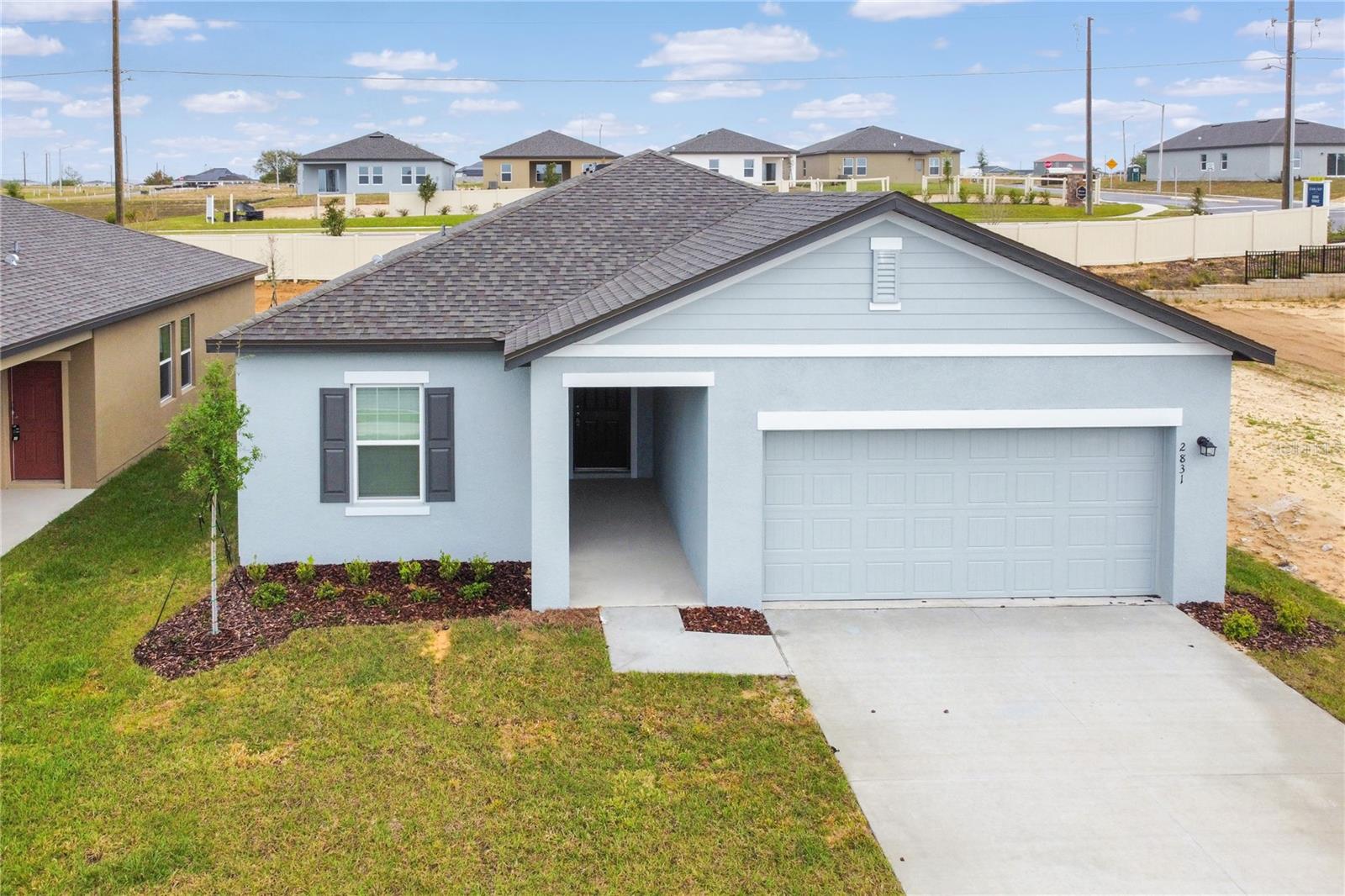 Now available for rent: This gorgeous, newly built energy-efficient home is located in the desirable Scenic Terrace community in Lake Hamilton, just outside of Haines City. Offering 4 bedrooms, 2 bathrooms, and over 2,000 square feet of total space, this one-story home features a bright, open layout perfect for both everyday living and entertaining. The modern kitchen comes equipped with brand-new stainless steel GE appliances, granite countertops, and upgraded cabinetry. The spacious primary suite includes a large walk-in closet and a stylish bathroom vanity for added comfort.
Additional highlights include an energy-efficient design to help lower utility bills, epoxy-coated garage floors for easy maintenance, and a MyQ smart garage opener. High-speed internet is included in the rent. Step outside to enjoy the peaceful backyard or relax on the welcoming front porch.
Scenic Terrace offers resort-style community amenities such as a clubhouse, pool, and parks. Conveniently positioned between Tampa and Orlando, you're within easy reach of Central Florida's best attractions—just 15 minutes to Legoland, 45 minutes to Disney, and 50 minutes to Universal. Everyday conveniences like shopping, schools, hospitals, and more are only minutes away. Fire station is just 0.3 miles down the road.