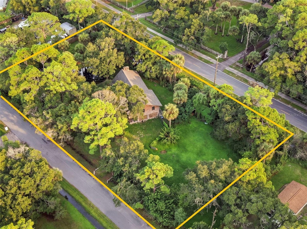 Photo of 4295 Lakeridge Drive, Melbourne, FL 32934 (MLS # O6448854)