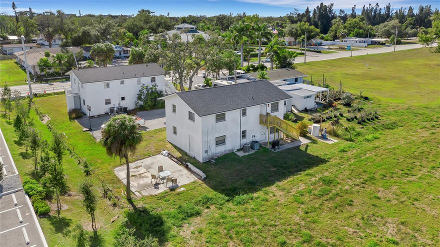 This rare coastal multifamily opportunity offers strong value-add potential in the highly sought-after Nokomis–Venice corridor, just off U.S. 41 (Tamiami Trail)—one of the region’s busiest commercial and residential corridors. The property currently consists of four units across two concrete-block buildings on a 14,130 sq. ft. lot, with flexible RMF-3 zoning that allows for expansion to a total of six units. Existing layouts include a mix of two 2BD/2BA and two 3BD/2BA units, with the potential to create four 1 BD/1BA units through strategic renovation or redevelopment. Recent capital improvements—new roofs, multiple AC systems, renovated kitchens, and full connection to public water and sewer (2022)—significantly reduce near-term expenses and position the property for immediate income growth. Current rents are approximately $200 below market, and occupancy stands at 50%, offering substantial upside. Durable concrete-block construction, in-unit laundry, patios/balconies, and central AC enhance long-term tenant appeal. The property’s prime location delivers high visibility and convenient access to Nokomis Beach, Venice Island, I-75, and major Sarasota employment centers, drawing a broad and steady renter base. Importantly, only one of the two buildings has been fully renovated, leaving additional value-add potential through upgrades to the second building—as well as the ability to increase density under existing zoning. This investment represents a rare chance to acquire a coastal multifamily asset in a supply-constrained, high-demand rental market, with both near-term income upside and long-term appreciation potential—plus the unique opportunity to expand from four units to six.
