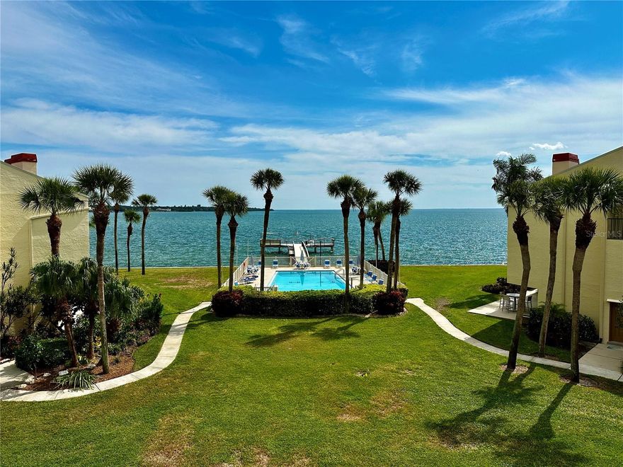 Breathtaking Waterfront Living Awaits in this Ocean-View Condo! Prepare to be captivated by the stunning water vistas that grace almost every corner of this remarkable home. Floor-to-ceiling, wall-to-wall windows along the entire bay side of this exquisite condo provide uninterrupted views that will leave you in awe. Step onto the waterfront balcony, which stretches the entire length of the home and is accessible from the living room and both bedrooms, offering a front-row seat to watch marine life frolic in the water and catch the sight of majestic cruise ships en route to Port Tampa. Inside, the open and inviting split floor plan strikes a harmonious balance between spaciousness and coziness, awaiting your personal touches to make it truly your own. All sliding doors have been updated to hurricane-rated doors and new laminated flooring has just been installed. Located in the peaceful and tree-lined community of Seapointe Terrace Condos, tucked away on the tranquil south tip of St. Pete, you'll enjoy minimal traffic and excellent fishing opportunities. The community boasts a range of amenities, including tennis courts, a clubhouse, a new kayak lift, kayak storage, a fishing pier, a car wash station, and bike storage. Don't forget the generously sized pool with a mesmerizing ocean view. With quick access to I-275, the beaches, Downtown St. Pete, Tampa, and Bradenton, as well as several nearby parks and marinas, this location is a waterfront lover's dream. Don't miss out on this incredible opportunity for waterfront living at its finest!