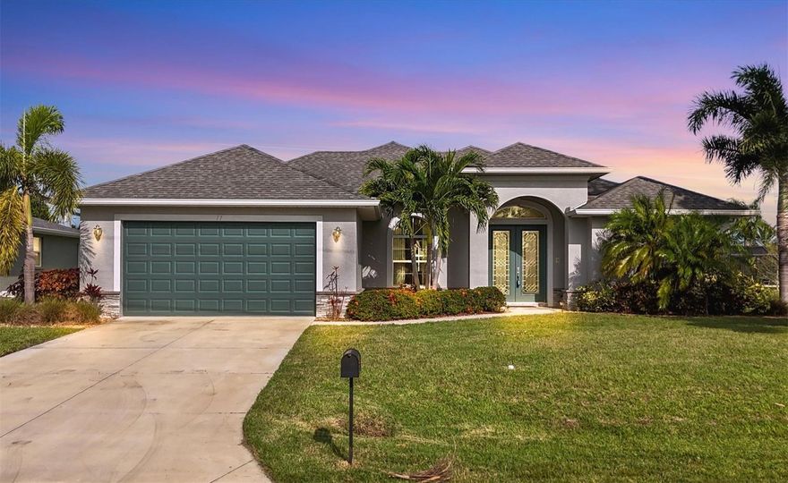 The Florida Lifestyle You Have Dreamed About Awaits in Rotonda West! Upon your arrival, you'll immediately be captivated by the stunning curb appeal. The multi-dimensional roof, mature tropical landscaping, decorative stone accents, and exquisite double lead glass doors with a transom window all create a warm and inviting entryway. This home is also located in an "X" flood zone. Step inside to find architecturally designed columns, lighted tray ceilings with crown molding, upgraded lighting and ceiling fans along with plenty of natural light from the triple sliders all work together in the great room, dining area and kitchen to create a truly luxurious living space.The kitchen area is both beautiful and functional with the wood cabinets, granite countertops, glass tile backsplash, a suite of stainless steel appliances, breakfast bar and fantastic views through the aquarium window. The split bedroom floor plan will provide plenty of privacy for you and your guest. The ensuite primary bedroom is a true retreat with a tray ceiling, lanai access through the sliding glass doors, and oversized walk-in closet. The master bathroom features a dual sink vanity with tons of drawers and granite countertops, a tiled walk-in shower, separate water closet and linen closet. There are two guest bedrooms, one with sliders to the pool and a walk-in closet. The guest bath has a great tub/shower combo with glass tile and vanity with granite countertop. The laundry room has a built-in sink with granite top and an abundance of cabinets. As you step onto the lanai you will find the perfect place to both entertain and relax by the heated pool with sunshelf, a convenient pool bath, bug screening, and room for everyone to kick back and enjoy the sunshine. Highlights of this home also include the “X” flood zone, wood-look tile throughout most of the home, impact windows (except for the aquarium window, which has a metal hurricane shutter), an abundance of storage space, built-in security system, intercom, surround sound, 6” baseboards, and high ceilings. This wonderful community Rotonda West has affordable annual fees and provides access to multiple public golf courses. Additionally, it's conveniently located near the beautiful beaches of Englewood and Boca Grande. Within minutes, you'll find many local dining options, marinas, prime fishing, the Atlanta Braves Spring Training facility, and historic Dearborn St. If you are ready to start living the good life, make an appointment today.