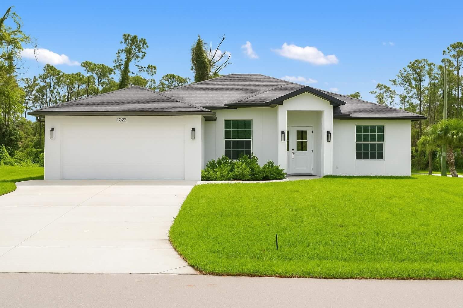 Welcome to this stunning, custom-built home on an oversized corner lot in the heart of North Port. Featuring 3 bedrooms, 2 bathrooms, plus an office, this split-bedroom design offers privacy with the primary suite on one side and the guest bedrooms on the other. The office is conveniently located at the front of the home, just off the entryway.
Inside, you’ll find soaring ceilings and a bright open floor plan with a spacious living room accented by elegant Spanish porcelain tile. The gourmet kitchen includes quartz countertops with backsplash, tall soft-close cabinets, a breakfast bar, and premium appliances. Both bathrooms feature custom tilework, quartz counters, and beautifully tiled walk-in showers.
This home is loaded with upgrades, including a WHOLE HOUSE REVERSE OSMOSIS WATER SYSTEM—a rare and valuable feature providing pure water throughout the home. The full IRRIGATION SYSTEM keeps the lawn and landscaping lush year-round. It also includes hurricane-impact windows and doors, custom wood shelving in the pantry and closets, epoxy garage floor, a complete gutter package, sidewalk wrapping the home, a CULVERT PIPE WITH COMPLETE COVERED DRAINAGE SYSTEM, an extra-wide driveway, and a laundry room with utility sink.
Located near US-41, I-75, beaches, Wellen Park, shopping, and dining—this property combines comfort, convenience, and quality.
Don’t miss the chance to own this truly unique home. Schedule your private showing today!