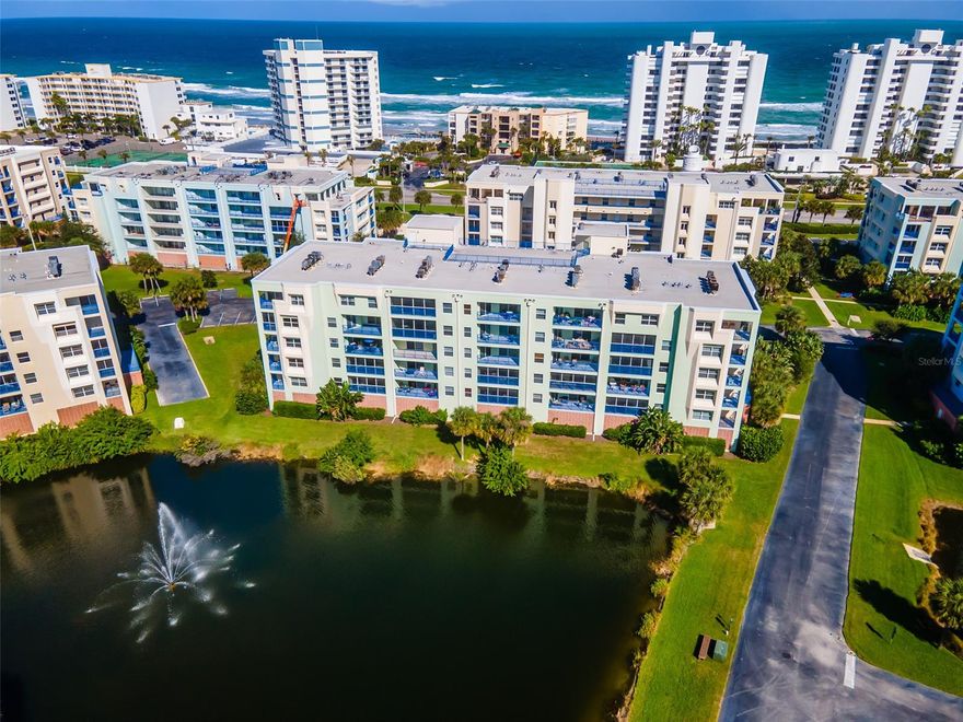 Beautifully updated and decorated 3 BR 2BA condo. Located in Ocean Walk, a gated access community with 2 pools, 2 clubhouses, tennis, shuffleboard and deeded access to the ocean just a 5 minute walk away. Featuring an open living / Dining / Kitchen floor plan this condo has been wonderfully updated with elegant dark granite in the kitchen and both baths and contrasting gorgeous white raised panel cabinets. This stunning kitchen has been updated with new appliances, new hardware, and new kitchen under cabinet lighting. New 2020 vinyl plank flooring compliment the open living space and kitchen area. New bedroom carpeting, ceiling fans, light fixtures, bathroom fixtures and front door. The screened patio faces West overlooking a pond with a fountain and a view of the rich evening colors as the sun sets. The master bedroom offers slider access to the patio and a spacious walk-in closet. The master bath has double sinks, a large jetted tub and a step in shower. Bedroom 2 offers direct access to the shared guest bath offering a measure of privacy to your valued guests. Building 15 has gated first floor garage parking. Ample parking for additional and visiting vehicles is available outside the garage. The unit also has an owners storage closet on the same floor as the unit for those extra items. Don't miss the opportunity to make this your piece of paradise at the beach! ;LocationDescription: Condo ;Water: City