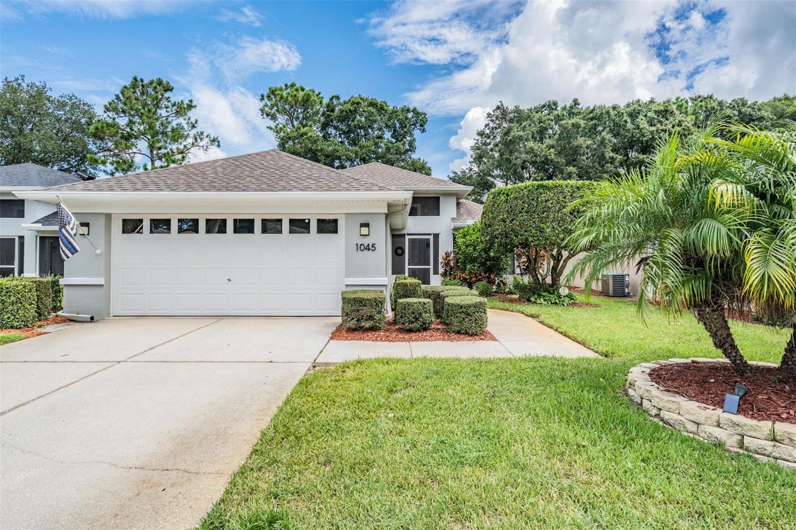 Fantastic and sought-after community, bring your toothbrush and let the fun begin! HURRICANE WINDOWS 2018, ROOF 2019, HOUSE PAINTED 2020, WATER SOFTENER 2020, NEW BATHROOMS 2021, DESK & CABINETS 2021, HOT WATER HEATER 2022, SCREEN 2023, LANAI 2024, NEW CARPET 2024, LIGHTNING AND FANS 2024. HOA INCLUDES: COMMUNITY POOL, TRASH, INTERNET, CABLE, IRRIGATION, LAW, MULCH, AND FERTILIZING. Beautifully maintained home in sought-after Wyntree, that is a maintained neighborhood and NOT age restricted, offering a perfect blend of style, comfort, and functionality. The inviting screened-in front porch sets the tone for the warmth you’ll find inside. Step into the large, open great room where soaring ceilings create an airy feel, and the dining area provides tranquil views of the lanai. The kitchen is a true chef’s delight, featuring stainless steel appliances with generous cabinet storage. Retreat to the spacious primary suite, complete with a tray ceiling, a large picture window that floods the room with natural light, and a remodeled en-suite bath boasting an oversized step-in shower and double granite vanity with abundant storage. The second bedroom offers ample space, while the versatile flex room easily serves as a third bedroom or home office. Enjoy year-round living in the enclosed sunroom, with direct access to the backyard, or relax on the expansive screened-in and covered lanai overlooking a private greenspace. Additional highlights include a walk-in laundry room with built-ins and access to an active community with a gorgeous pool. This home truly has it all—don’t miss your chance to make it yours!