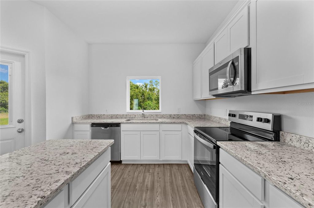 Photo of 547 Bay Leaf Drive, Poinciana, FL 34759 (MLS # TB8436023)