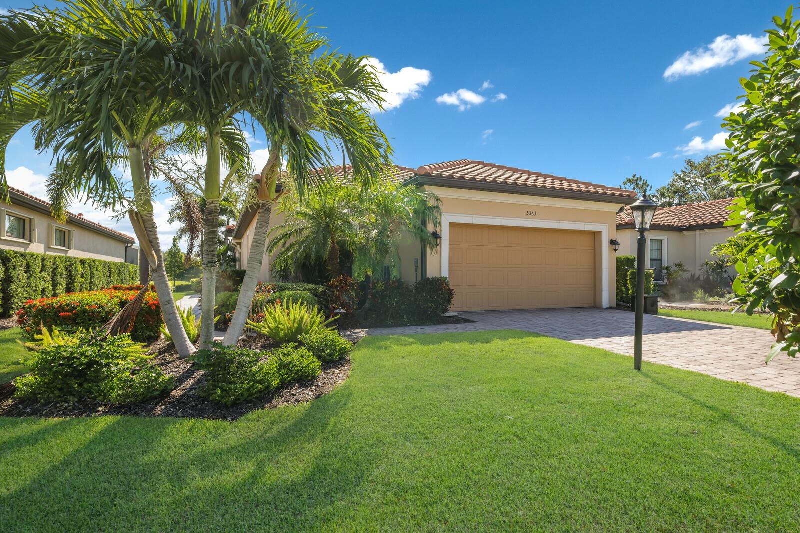 Welcome to Your Slice of Paradise in Lakewood Ranch Escape to luxury in this beautifully appointed Arezzo model by Taylor Morrison, offering 3 bedrooms, 2 baths, and a versatile den. The perfect retreat for seasonal living or entertaining in style. Thoughtfully designed with an open-concept layout, this home makes hosting family and friends effortless. At the heart of the home is a stunning chef’s kitchen featuring gleaming granite countertops, stainless steel gas appliances, 42” upper cabinets with under-cabinet lighting, and a seamless flow into the dining and living areas. Step outside to your oversized screened-in lanai, complete with a full outdoor kitchen — the ultimate spot to unwind with a cocktail while watching the sun set over serene Florida skies. The luxurious primary suite features a king-sized bed, a spacious walk-in closet, and a spa-inspired bathroom with dual vanities and a custom-tiled shower. Guests will feel right at home with two beautifully furnished guest bedrooms — one with twin beds and an ensuite bath, the other with a queen bed and stylish finishes. Additional high-end touches include crown molding, tray ceilings, designer shutters in every room, a spacious in-home laundry room, and a two-car garage with additional driveway parking. Optional golf & full club membership transfer available for just $250. As a guest, you’ll enjoy full access to Esplanade’s resort-style amenities, including: A breathtaking lagoon-style pool & spa, Heated resistance pool, Poolside Bahama Bar, Pickleball, tennis & bocce ball courts, Outdoor BBQ areas & fire pits, Newly completed Culinary Center with events and dining! Located in the heart of Lakewood Ranch, this maintenance-free, gated community puts you minutes from I-75, world-class dining, boutique shopping, white-sand beaches, and the renowned University Town Center Mall. Come experience the all-inclusive resort lifestyle you deserve — welcome home. Rentals less then 6 month's include utilities and is subject to sales and Resort Taxes (13%). One month's security deposit, application fee, and $150 HOA rental processing fee required. In Season December - April ($9,000/month).