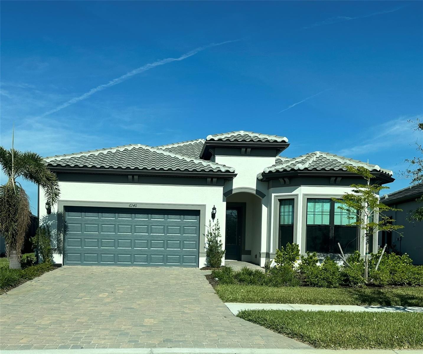 For Rent in the gated community of Talon Preserve on Palmer Ranch: Spacious and light-filled 3-bedroom, 2.5-bath home offering 2,098 sq. ft. of living space with soaring 10’7” ceilings, an open-concept layout combining living, dining, and kitchen areas, gas cooking, matching quartz countertops, wood cabinetry with soft-close drawers, oversized island, stainless steel appliances, large walk-in pantry, new DC fans and lighting, porcelain tile flooring throughout (no carpet), laundry room with slop sink, two oversized primary closets, impact windows and doors, 4-ft extended garage, and a private backyard. Located less than a block from the new amenity center featuring a lifestyle director, resort-style pool and spa, fitness center, yoga/dance studio, game and activity rooms, lounge areas, catering kitchen, tennis, pickleball, bocce, playground, dog park, private Legacy Bike Trail access, indoor neighborhood bar and restaurant; golf carts welcome and lawn maintenance included. Only 8 minutes to Nokomis Beach—enjoy resort-style living at its finest!