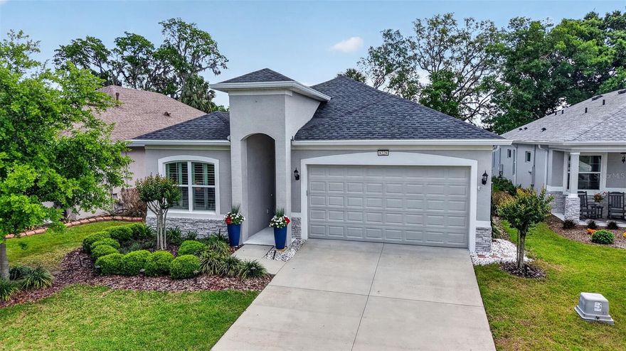 Welcome to 8228 Bridgeport Bay Circle, in the Lakes of Mount Dora, a highly coveted, amenity-rich, 55+ Active Adult Community in Central Florida's charming town of Mount Dora. 

Come experience this 2061 square foot home, featuring a flexible, modern, and sleek open-concept floor plan, ideal for both tranquil privacy and communal gatherings. The living space is enhanced by the perfect offset laid neutral ceramic tile, a tray ceiling, transom windows, and a climate-controlled, four-season room that floods this home with abundant natural light

The chef-inspired kitchen is the heart of the home, with stunning white "marbled" quartz countertops on both the island and cooking surfaces. Matching the countertop’s swirl color perfectly are the 42-inch soft-close cabinets and drawers. Rounding out this fantastic kitchen is the suite of high-end stainless-steel appliances, including a 5-burner gas cooktop, stacked wall oven, convection microwave, refrigerator, and dishwasher.


The generous Primary Suite provides a private sanctuary with walk-in closets and an opulent en-suite bathroom featuring dual vanities, a luxurious soaking tub, and a separate, no-step walk-in shower.

Bedroom 2 and bathroom 2 are conveniently situated in a split floor plan at the front of this lovely home for maximum privacy, ideal for guests and owners alike who cherish peaceful slumber. 

Currently an art studio, the Flex room can easily transform into your new office, media room, “She-Shed,” or “Man-Cave.” Just bring your design imagination. 

Residents of The Lakes of Mount Dora enjoy an extraordinary, resort-style lifestyle with amenities that include the 18,000-square-foot clubhouse, Lake County's largest resort-style pool, pickleball, tennis, bocce ball, a croquet lawn, 4 miles of scenic trails and waterways, a community fire pit, and secure gated RV/boat parking. The HOA fee of $290 monthly also covers Fiber optic internet & cable, irrigation, and access to a wide variety of clubs and social activities. For golf enthusiasts, the home is minutes away, with direct golf cart path access to the Country Club of Mount Dora's challenging 18-hole course. Beyond the community, you are minutes from the charming towns of Mount Dora, Tavares, and Eustis, offering art galleries, festivals, dining, unique shopping, and boating. The home i
s also conveniently located just 45-to-60 minutes from Greater Orlan
do's world-renowned theme parks and Florida's most celebrated beaches, offering an exceptional balance of accessibility and serene living. This is more than a home; it's an entrance to a vibrant, engaging 55+ active-adult lifestyle. Come see why the Lakes of Mount Dora is recognized as one of the "Top 50 Best Master-Planned Communities in the United States" by Where to Retire magazine.