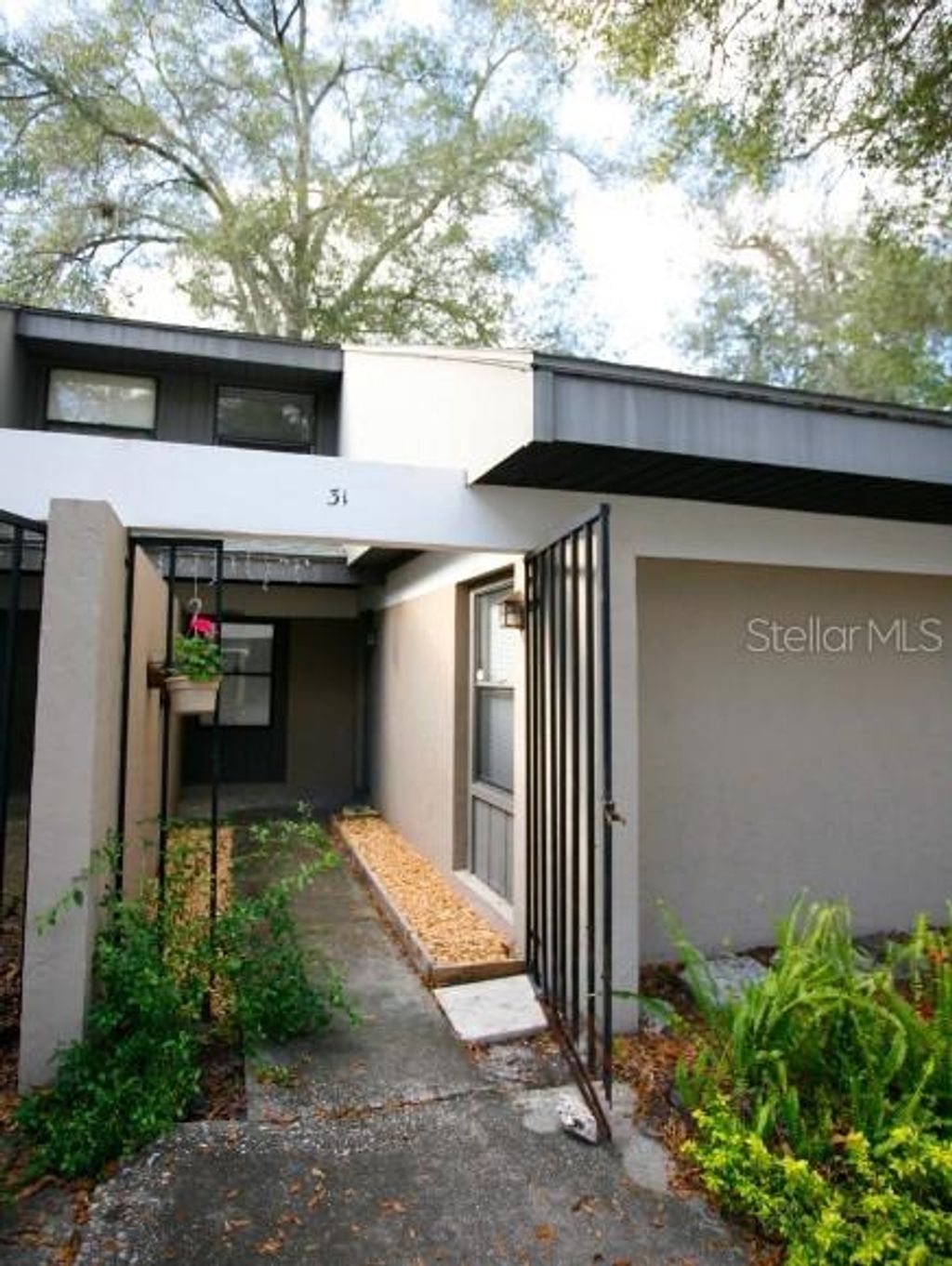 Photo of 7200 SW 8th Avenue #E31, Gainesville, FL 32608 (MLS # GC536108)