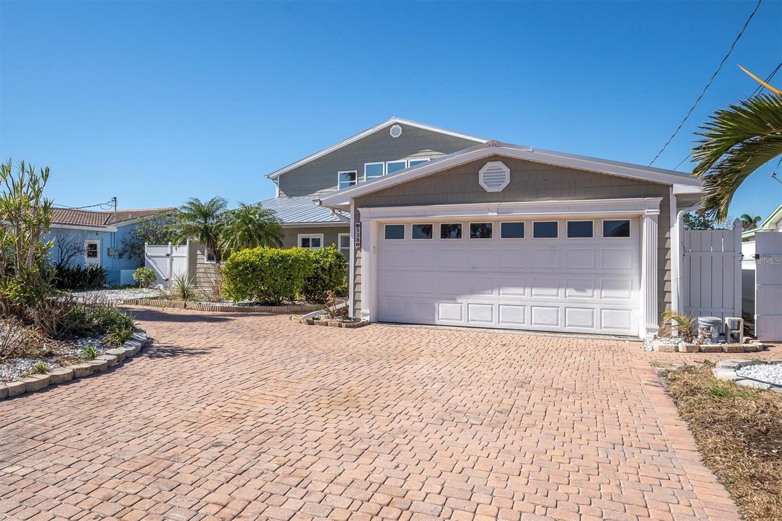 Welcome to *Life’s Oasis*—a fully redesigned 5-bedroom, 4-bath waterfront retreat on sought-after Crystal Island in Madeira Beach. This spacious 2,800+ sq ft home has undergone over \$400,000 in high-end renovations, blending luxury, function, and Florida charm. Ideal for multi-generational living or hosting, it features dual master suites—one on each level—each with stunning ensuite baths. The downstairs primary is wheelchair accessible and boasts his-and-hers bathrooms, a walk-in closet, and private access to the pool. Upstairs, enjoy water views from the balcony and a spa-like bathroom with Bluetooth audio and multiple shower heads.
Perfect for boaters and beach lovers, this home is just a short walk to the sand and offers two boat lifts (10k & 20k lbs), a newly resurfaced Pebble Tec pool, extended sun deck, and an oversized waterfront patio ideal for entertaining. The redesigned gourmet kitchen, expanded dining space, and multiple living areas offer the ultimate in coastal living. Additional upgrades include hurricane-impact windows and doors, new AC systems (2022 & 2025), updated landscaping, and a screened porch for enjoying Florida breezes. The project is nearly complete—offering a rare opportunity to own a turnkey waterfront oasis.