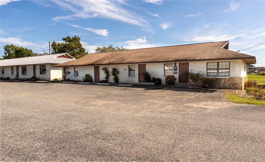 Exceptional commercial opportunity in the heart of Tavares! This property features two professional office buildings totaling over 5,100 square feet with excellent visibility and frontage on E Alfred Street.
The first building (approx. 2,940 sq ft) is currently home to a well-established chiropractic office, offering a welcoming reception and waiting area, multiple exam and treatment rooms, private offices, and restrooms—ideal for medical, wellness, or other professional use.
The second building (approx. 2,184 sq ft) is divided into six individual office suites, each with its own entry making it perfect for rental income or a multi-tenant professional setup.
The property also includes a large paved parking lot providing ample parking for staff and visitors, and a spacious adjacent buildable lot, offering room for future expansion or additional development. With two street-front marquees for maximum exposure, this property combines flexibility, functionality, and investment potential.
Located in the growing business district of Tavares, close to government offices, medical centers, and major thoroughfares, this property is ideal for an owner-occupant or investor seeking a high-visibility commercial site with room to grow.