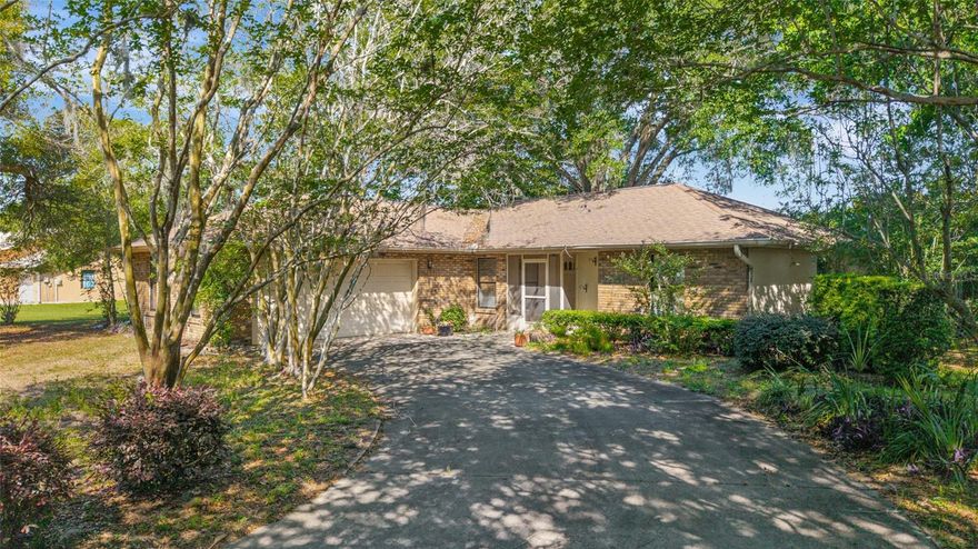 Tucked away on a generous 0.31-acre lot in desirable southwest Ocala, this charming 3-bedroom, 2-bath home offers a wonderful opportunity to create something truly special. Lovingly cared for by the same family for years, it’s now ready to welcome new owners to make it their own.
Inside, you’ll find a comfortable layout featuring a living room, separate dining room, and a bright, spacious 375 sq ft sunroom at the back of the home—perfect for relaxing, entertaining, or enjoying views of the backyard year-round. The spacious kitchen offers a breakfast bar, ample storage, and a cozy breakfast nook, complete with a window overlooking the backyard—ideal for enjoying your morning coffee. The primary suite includes a walk-in shower and a walk-in closet with a built-in closet system. The second and third bedrooms share a full bathroom with a tub/shower combination, offering functionality for family or guests. You’ll also appreciate the convenient indoor laundry room with additional shelving for storage. Outside, the long driveway provides ample parking, and the large 2-car garage offers plenty of room for vehicles plus extra storage space. Set in a peaceful location while still conveniently close to SW 103rd Street Rd, with quick access to CR 484 and I-75, you’ll enjoy both tranquility and easy access to shopping, dining, and commuting routes. Additional highlights include an AC system replaced in 2018, water heated installed 2011 and septic recently serviced. With solid bones and plenty of space inside and out, this home is full of potential and ready for its next chapter.