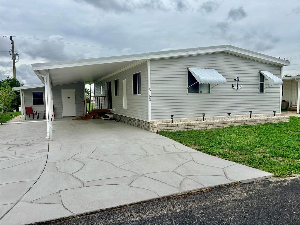 Photo of 3163 Indian Village Lane, North Fort Myers, FL 33917 (MLS # A4696769)