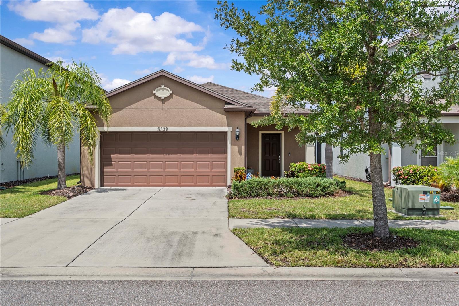 Located in the gated community of Magnolia Park, this 2017-built home sits on a premium waterfront lot where you can unwind each evening with breathtaking sunset views right from your screened-in lanai. This home offers a smart, open-concept layout with 3 bedrooms and a versatile flex room that easily transforms into a home office, playroom, or 4th bedroom. The heart of the home—the kitchen—features granite countertops, wood cabinetry, stainless steel appliances, a stylish backsplash, and a large island perfect for gathering during meals or celebrations. Enjoy added touches like granite bathroom vanities, and ample storage space. The spacious backyard offers plenty of room, and the water view adds a tranquil, everyday escape right from your own home. With quick access to I-75, the Crosstown Expressway, downtown Tampa, and MacDill Air Force Base, this home blends comfort, convenience, and community into one incredible opportunity. Make every day feel like a getaway—schedule your private tour today.