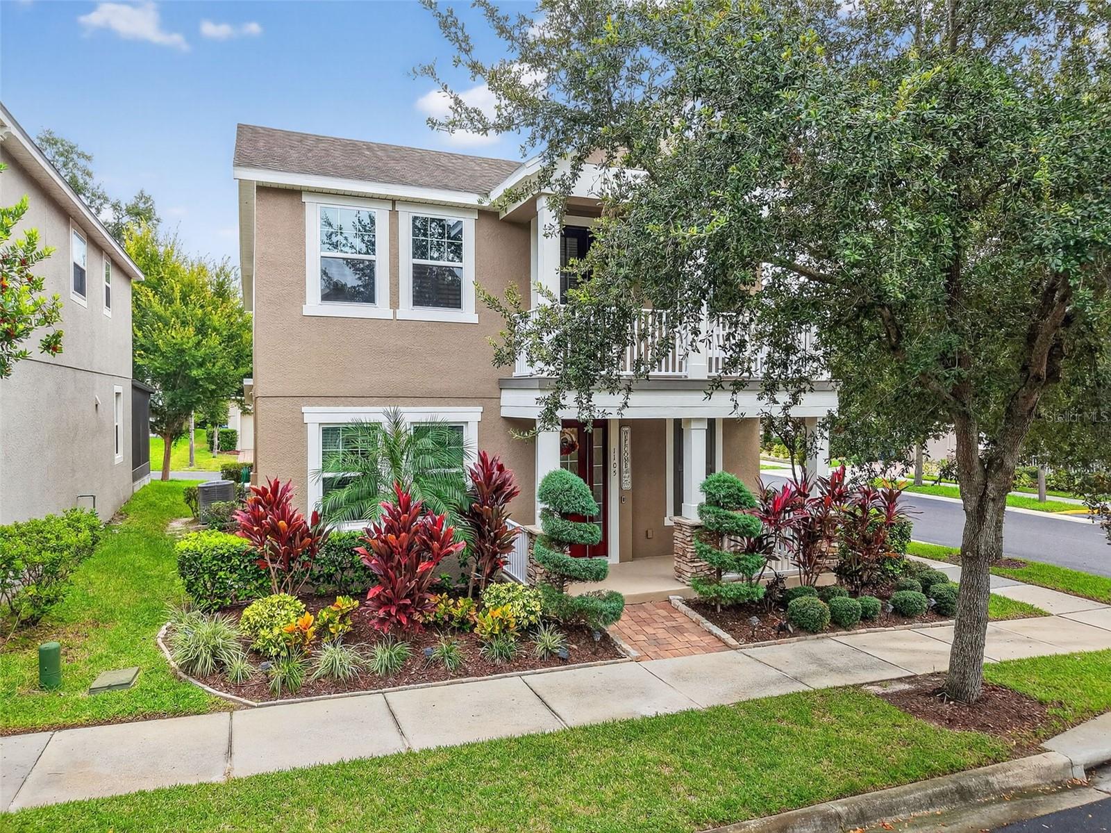 Welcome to Spring Lake Reserve, where modern living meets timeless charm. This beautifully upgraded former model home offers 3 spacious bedrooms, 2.5 bathrooms, with indoor and outdoor living spaces designed for comfort, style, and functionality.
Set on a desirable corner lot just steps from the community pool and playground, the home greets you with fresh exterior paint, professional landscaping, and a welcoming covered front porch. The porch extends to an upper balcony complete with a swing and outdoor fan, the perfect spot to unwind on breezy afternoons. For added curb appeal and convenience, you’ll also enjoy a rear-facing 2-car garage with paver driveway.
Inside, the home blends sophistication with warmth and a fabulous mirrored stone feature wall. Contemporary light fixtures, tile flooring, and a flexible floor plan create a bright, inviting atmosphere. Just off the foyer, double French doors open to a private office or den—ideal for working from home or creating a hobby space.
The open living area flows seamlessly into the chef-inspired kitchen, featuring two-tone cabinetry to the ceiling, stone counters, shaker-style cabinets, a farmhouse sink, stainless steel appliances, and a custom tile backsplash. A charming dining nook with a stone feature wall and sliding doors to the screened lanai makes everyday meals feel special.
Upstairs, a versatile loft connects the bedrooms and leads to the private balcony. The primary suite is a true retreat with a tray ceiling, 2 walk-in closets, and a spa-like bath complete with dual vanities, a soaking tub with custom tile surround, and a glass-enclosed shower. Two additional bedrooms share a beautifully appointed bath with dual sinks and plenty of storage.
Notable enhancements include updated landscaping and exterior paint, contemporary light fixtures throughout, balcony swing with outdoor fan, keyless touchscreen front door lock and front and rear entry security cameras for added security.
As part of Spring Lake Reserve’s gated community, residents enjoy access to a sparkling pool with splash pad, playground, and open green spaces—all within minutes of major roadways, Lake Apopka, parks, shopping, and dining.
This home combines the refined upgrades of a model home with thoughtful, modern touches for today’s lifestyle. Schedule your private showing today and discover why 1105 Eagle Run Way is the perfect place to call home.
