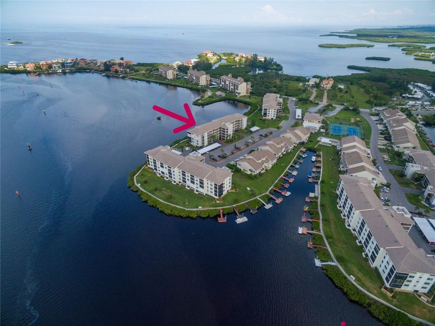 Beautifully furnished PENTHOUSE unit with direct view of the Gulf of Mexico from almost every room. Practically every single detail is new since 2022! Gorgeous kitchen with raised ceilings, NEW cabinetry with soft close doors/drawers, NEW quartz counter tops, NEW smudge free stainless appliances, energy efficient fridge, NEW Stove (per Seller- the stove features air fryer, thermometer and convection oven) and NEW remote controlled accent lighting above cabinets. Great room with NEW remote controlled fan/light, sliding door access to lanai which offers a bird's eye view of the Gulf of Mexico, and a little inlet where the Dolphin frequent to fish. Dining room has seating for 4, living room with NEW Queen sized sofa bed, and ceiling fan, Large master suite includes a king size bed (adjustable with remote), a NEW remote controlled fan/light, direct view of the Gulf of Mexico, walk in closet, additional linen/storage/clothing closet, en suite bath with NEW vanity/counter tops, NEW toilet and NEW walk in shower with frameless glass doors (handicap accessible). Front guest bedroom includes a queen size bed, ceiling fan, large closet. Guest bath with NEW vanity/counter tops and  tub/shower. NEW plantation shutters in all windows, NEW designer window in front door, NEW vinyl flooring and baseboard throughout. NEW paint throughout with crown molding. Popcorn ceiling removed and ceiling texture throughout, NEW bifold doors on closets and NEW locks/hinges on passage doors, NEW outlets, switches and plates throughout. ***NEW ENERGY STAR PGT 5510 TRIPLE PANE CUSTOM HURRICANE 5 RATED IMPACT WINDOWS THROUGHOUT  WITH A 25 YEAR WARRANTY TO TRANSFERABLE TO NEW OWNER***. NEW windows screens throughout, NEW LARSON front storm door with built in “screen away” and lock set, NEW lanai railing and screens installed with removable top screens. Electric storm shutter on lanai (operated with wall switch or manually). Electric in hall linen closet convenient for vacuum. NEW Hot Water heater. AC works great (not new but Seller says it works great and it is covered under transferrable home warranty). One assigned, under building parking spot with assigned storage locker. Comes with Ring door bell, 75" and 55" flat screen smart TVs, all furniture, can even include kitchen ware/linens if you desire! 2026 Monthly fee is $1090.83 ($468.40 Flood and Hazard insurance, $479.43 Maintenance, $143 Master Board-per Board Member) HOA fees includes: basic cable, wifi, trash, all exterior maintenance, all exterior insurance, lawn care, access to two swimming pools, 24hour manned security gate, community boat ramp, waterfront board walk, fishing pier, putting green, tennis, pickleball, clubhouse with fitness room, library, game tables, two card/game rooms. Owners in phase 1 can  get on list to purchase a PRIVATE boat dock and/or purchase a spot at the RV/Boat storage lot (Please inquire with Agent). Start enjoying the Salt Life right away! Close to historic downtown New Port Richey, close to public beaches, waterfront dining and water sports, shopping and medical. Approx 20 min to Tarpon Sponge Docks, 60 min to Tampa airport, cruise port, theme parks and nightlife. Approx 60 min to Clearwater Beach. NO PETS (unless Service Animal or ESA) and NOT AGE RESTRICTED. *** Sale excludes a few items. Listed in REALTOR only remarks*** BOAT DOCKS and RV/BOAT/KAYAK  STORAGE FOR PURCHASE (UPON AVAILABILITY WITH FEES).
