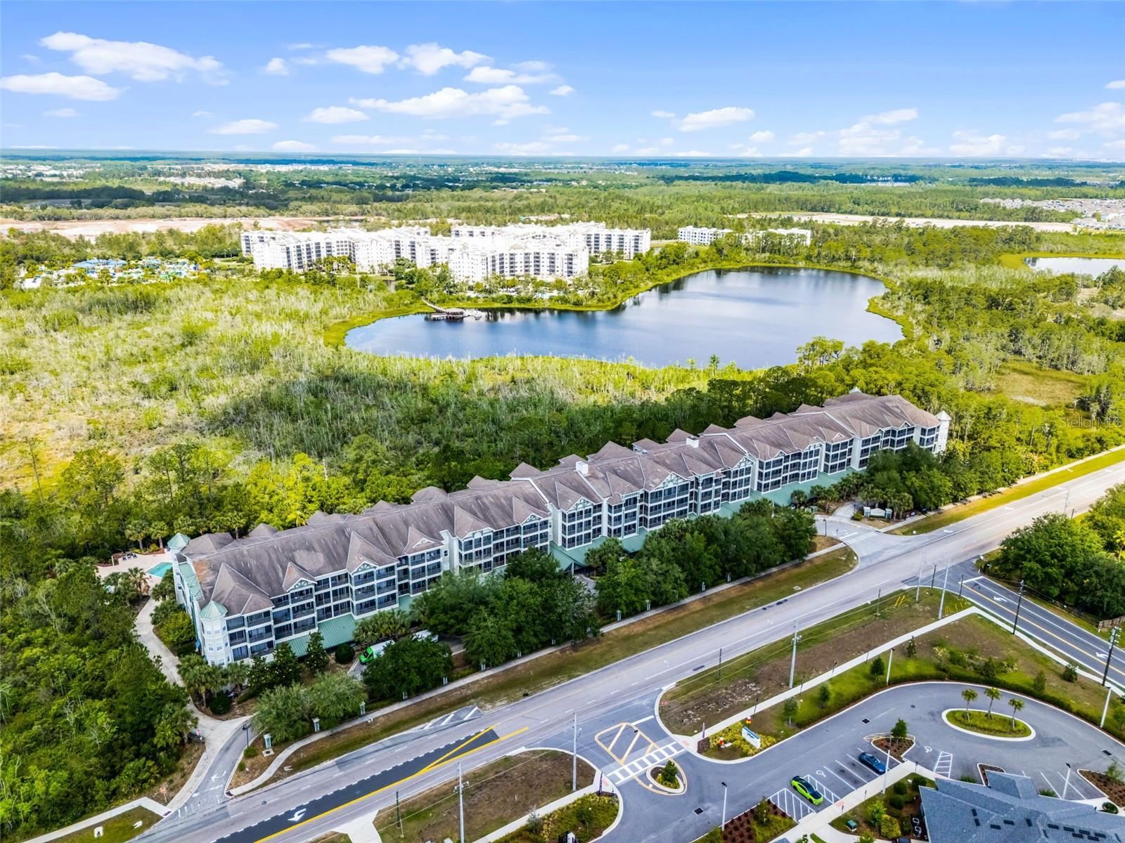 Welcome to The Palisades Condominium, where resort-style living meets unbeatable convenience, just 15 minutes from Walt Disney World! Whether you're looking for a full-time residence, a vacation retreat, or a short- or long-term rental investment, this stunning 2-bedroom, 2-full bathroom TOP-FLOOR condo checks every box.
Professionally renovated, decorated, and fully furnished, this spacious home offers over 1,200 square feet of stylish comfort. High-end features include luxury vinyl plank flooring throughout, crown molding, and an upgraded kitchen with 42-inch white cabinetry, stainless steel appliances, and elegant finishes down to the modern door hardware and cabinet knobs. A full-size washer and dryer are also included for added convenience.
The split floor plan ensures privacy and functionality. The primary suite features a king bed, 52-inch Samsung LED TV, an en suite bathroom with a garden tub, and a walk-in closet. The second bedroom boasts two queen beds, a 55-inch Samsung LED TV, a built-in closet, and a spacious en suite with a linen closet. The second bathroom has a door off the main living space for added convenience. The spacious living and dining area is perfect for gathering to share a meal, play a game or watch a movie on the 65-inch Samsung LED TV. Large sliding glass doors flood the living room and both bedrooms with natural light. Step outside to your oversized screened-in balcony, accessible from both bedrooms and the living room, perfect for relaxing in the Florida breeze.
The Palisades offers exceptional amenities, including covered parking for owners and guests, elevator access from the recently renovated lobby, a theater room on the first floor, a resort-style pool and hot tub, and a fully equipped fitness center.
This is a rare opportunity to own a turnkey, top-floor condo in one of Central Florida’s most desirable locations, perfectly positioned for lifestyle and investment.