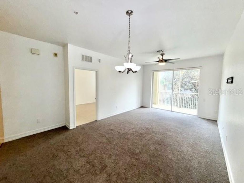 Photo of 3326 Robert Trent Jones Drive #202, Orlando, FL 32835 (MLS # O6395697)