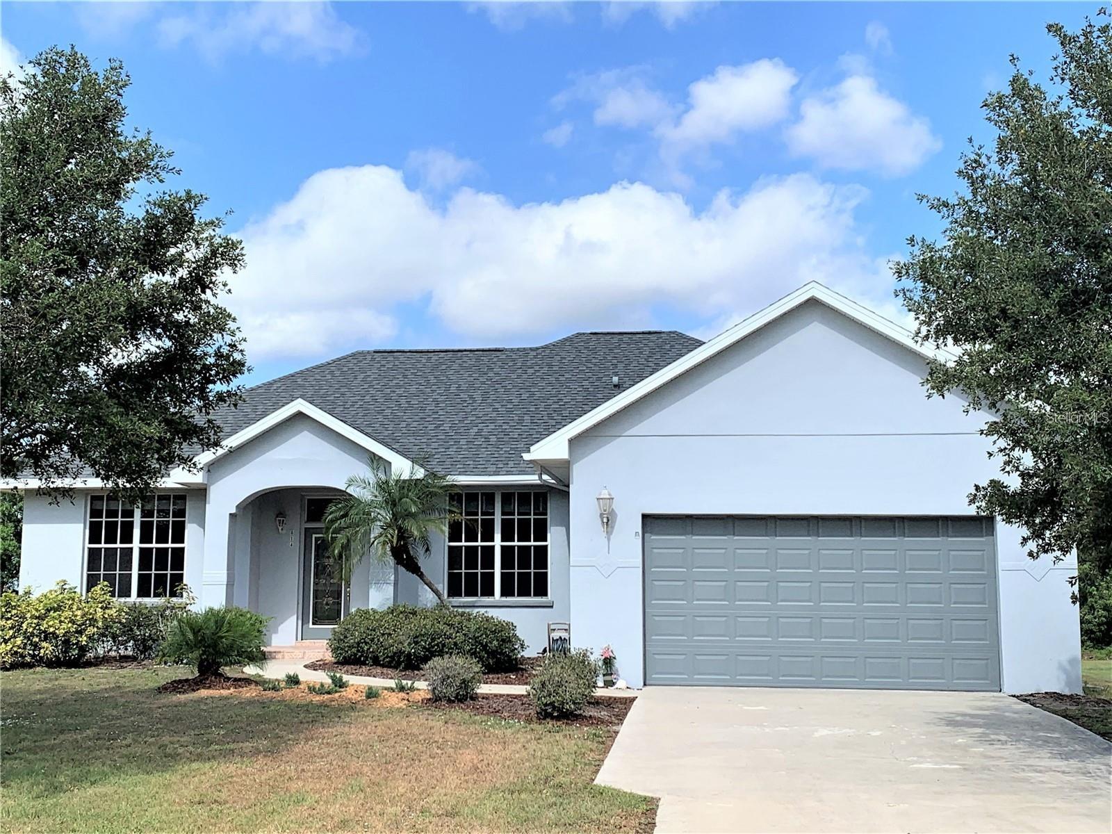 LIMITED-TIME OFFER! Sign a lease by July 30th and get a $600 rent credit for August. Completely updated charming home that situated on a spacious 0.6 acre + lot ! This 3-bed/2-bath home is located in the desirable Hidden Oaks Community in Bradenton, near Lakewood Ranch and Route 64. A gorgeous updated kitchen outfitted with BRAND NEW stainless steel appliances, wood cabinets, and a large kitchen island with granite countertops. Bay window in the kitchen with plenty of natural light let you appreciate the lush backyard. An open concept and 10 foot ceilings plus luxury Vinyl Plunk flooring ensures seamless flow between the kitchen, dining area, and living room this creates an inviting atmosphere for entertaining and creating lasting memories. The master suite has a large walk-in closet, a tub, and completely remodeled step-in shower and vanity. The split bedroom floor plan offers an optimal layout for functional and comfortable living. The laundry room has a built-in sink and brand-new washer and dryer. Step into the backyard oasis and discover the spacious covered and paved patio looking out into the fenced backyard. With its serene surroundings, this home provides an ideal retreat from the hustle and bustle of everyday life. Hidden Oaks community is 10 minutes from Lakewood Ranch, has easy access to I-75 and is close to St. Petersburg, Tampa, and Sarasota with all the amenities you desire. Live in this model-like home and enjoy all that upscale living. Don't miss the opportunity to make this home to your own piece of paradise in the heart of town!