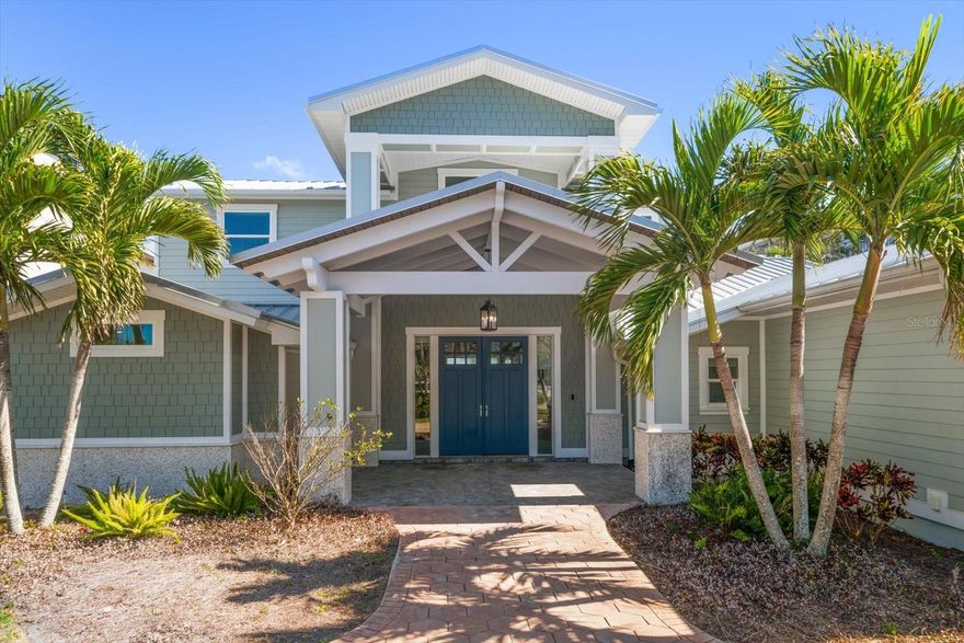 Located on the coveted and secluded north end of Clearwater Beach, this stunning waterfront home sits on an expansive lot, offering some of the most breathtaking views in the area. The upstairs was recently updated, and downstairs this blank canvas is primed and ready for you to add your own personal touch. A pavered circular driveway and a charming covered entry welcome you into a bright, open interior where walls of windows and French doors frame the sparkling pool, spa, and sweeping waterfront. The spacious dine-in kitchen is a dream for entertainers, featuring a massive island (slab provided), a pantry, and a bay window overlooking the water—perfect for watching dolphins and sea birds glide by. A versatile bonus room downstairs offers endless possibilities as a fourth bedroom, media room, or home office. This exquisite home boasts not one, but two luxurious primary suites—one conveniently located on the main level and the other upstairs—both featuring walk-in closets and stunning pool and water views. The light-filled upstairs guest suite includes an ensuite bath with a walk-in shower, providing ultimate comfort and privacy. A true boater’s paradise, this property comes equipped with a private dock and three boat lifts, making waterfront living effortless. Walk to the pristine white sands of Clearwater Beach or hop on a golf cart for a quick ride to your favorite beachside restaurant. Additional features include an elevator, a mudroom, a spacious laundry room with a pool bath, and an oversized garage. Experience the best of Clearwater Beach living in this extraordinary home!