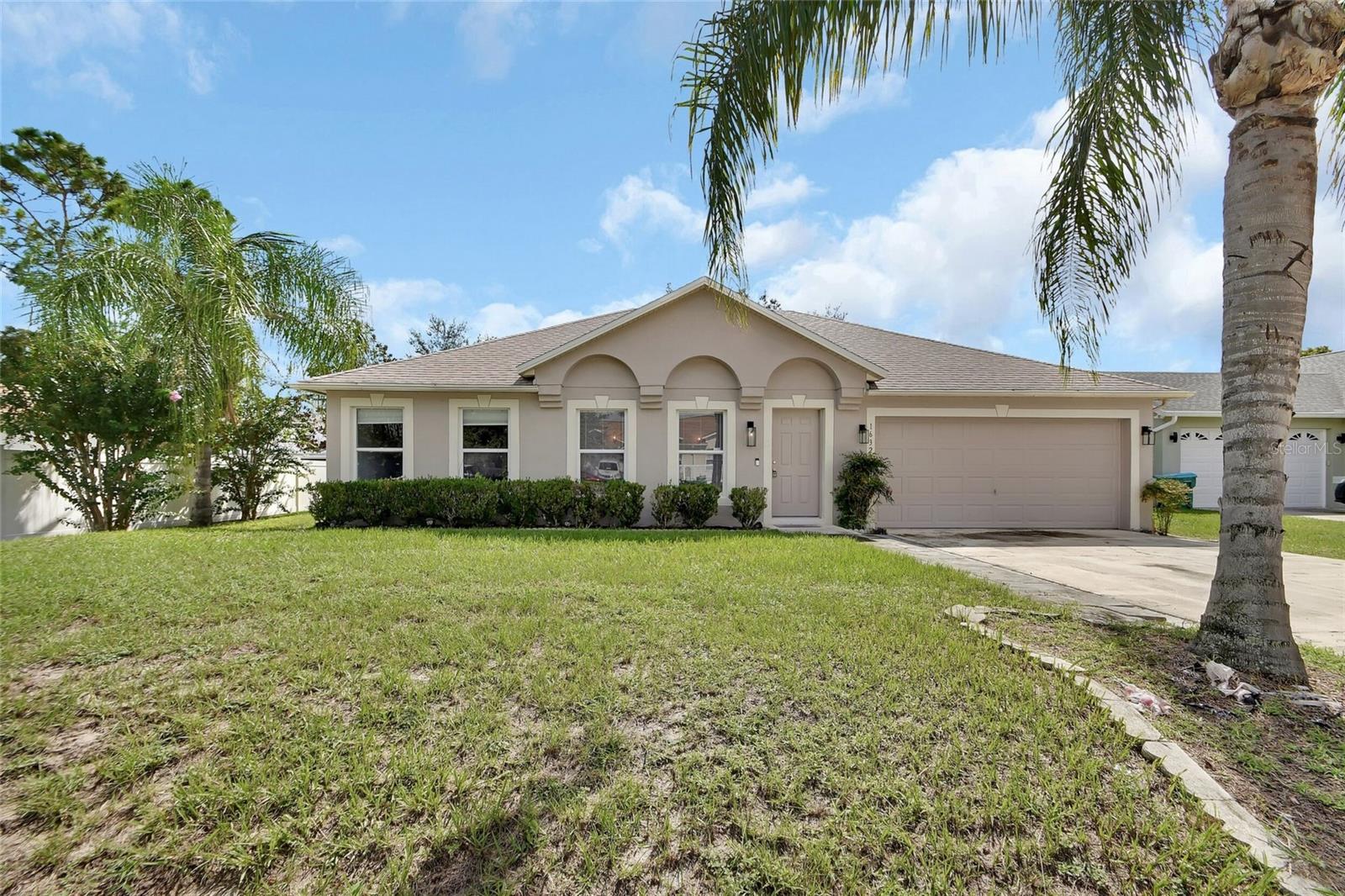 Welcome home! This spacious 4 bedroom, 2 bath home with 2-car garage offers 2,088 heated sq. ft. of comfortable living space in a prime Deltona location, just minutes to I-4 for an easy commute to both Daytona and Orlando. The heart of the home is the oversized kitchen featuring brand new stainless steel appliances, a huge butcher block island, and two large pantries—perfect for gatherings and meal prep. The split floor plan includes an inside laundry, a large living and formal dining combination, plus a generous family room open to the kitchen. Sliding glass doors from the dinette/breakfast nook lead to a 10x24 patio, ideal for cookouts and family fun. With a brand new HVAC system and a new roof in 2023, this home is truly move-in ready. Plenty of room for everyone—come see why this is the perfect place to call home!