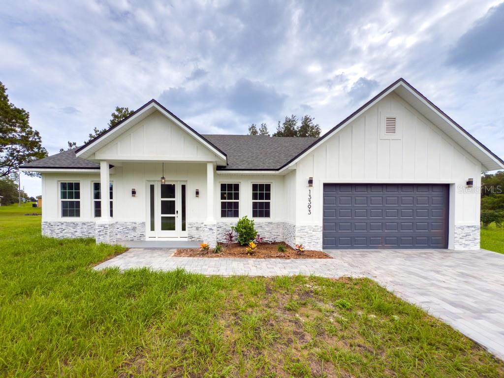 ** OVERSIZED LOT**This stunning home, located on a spacious lot has 4 bedrooms and 2 full bathrooms and 1 half-bathroom, large living room with open concept kitchen, equipped with stainless steel appliances including a range, refrigerator, garbage disposal, dishwasher, and microwave, as well as an island and ample cabinet space, perfect for hosting large family gatherings. Rooms are spacious and comfortable, which allows for seamless flow and natural light throughout the home. The house has several upgrades, such as vinyl flooring, floor to ceilings tiles on bathrooms and huge lanai with countertop and sink, plenty of space for outdoor kitchen. With a two-car garage, in addition to being more spacious, has a greater height than standard. It is a perfect place to live or invest.