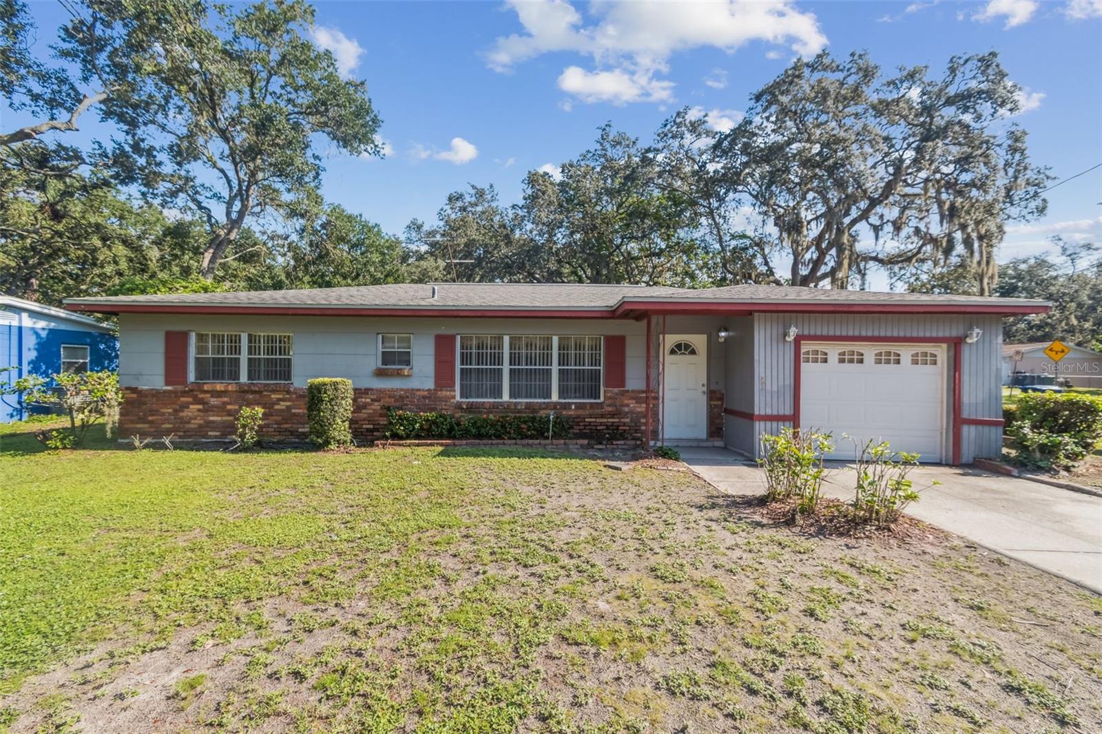 Charming corner lot concrete block home located in the heart of Tampa! Featuring three bedrooms, 1.5 bathrooms, a one car garage with a long driveway, an oversized den, and an interior laundry room. The home also comes with an outdoor shed that is powered with electricity and currently serves as a workshop. The backyard is huge with a beautiful mature mango tree offering tons of space for outdoor entertainment and comes fully fenced. Enjoy the benefits of a single-story layout, making it ideal for all ages. The roof is from 2020, the A/C is from 2019, and the home has been very well taken care of with lawn maintenance and pest control. Water heater is 3 years old. No HOA fees, no CDD fees for additional savings. Inside the home, you will discover a well-maintained interior offering plenty of natural light and a good distribution of space. The living areas are spacious and inviting. The home is situated near a variety of restaurants, minutes away from I-75 and I-4 and attractions such as Busch Gardens, the Hard Rock Casino, and the Rogers Park Golf Course. Woodland Terrace Park is conveniently located behind the home, and it features a walking trail, a recreational center, basketball courts and a children's playground. Other popular attractions include the Lowery Park Zoo, Sparkman Wharf, and the Riverwalk downtown area which are all located within a 6 miles radius. The home offers easy access to the Tampa Airport (TPA), about 1 hour from Disney Parks and the beaches! Close to public schools, Armature works, Midtown and Fire Rescue Station 18 is only 3 mins away! This home also qualifies for the First Home Assist DPA up to $15K grant. Enjoy the Florida lifestyle and schedule your tour today.