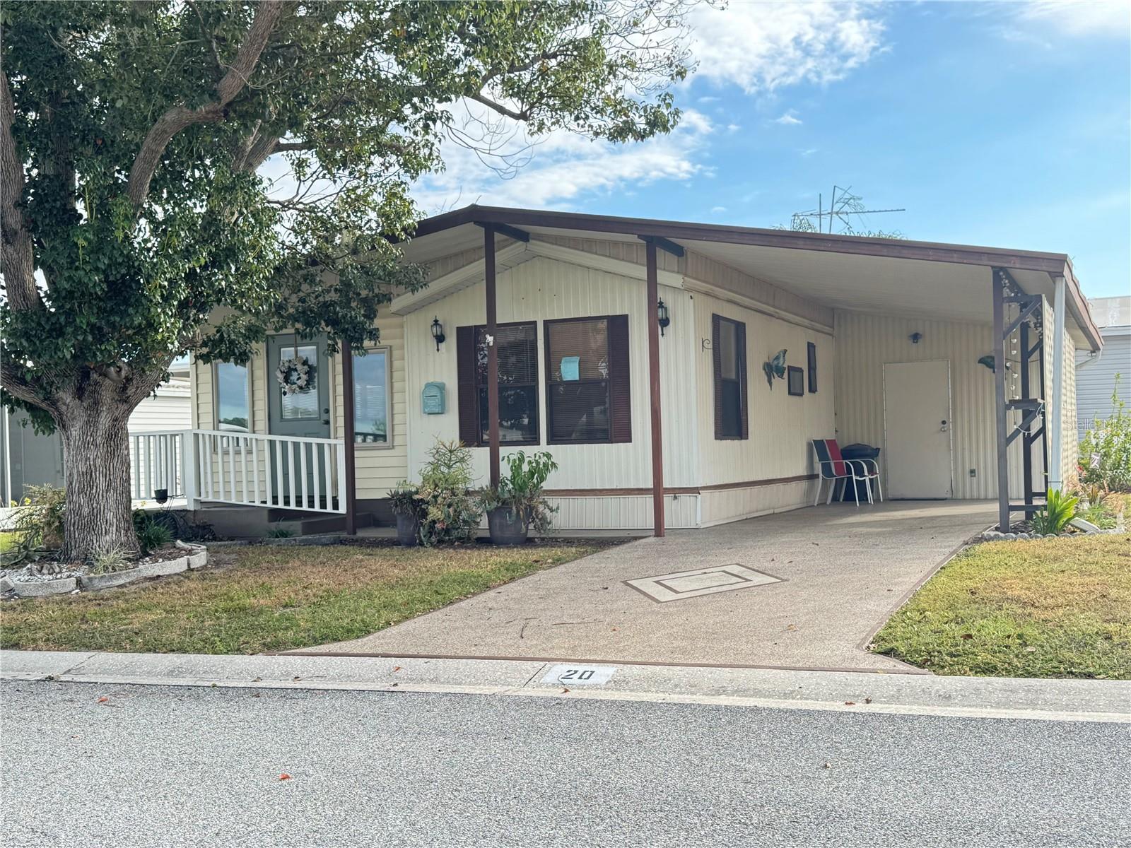 Welcome home to this beautifully maintained park model located in the desirable American Condominium Park community of Zephyrhills. Just across the street from all park amenities!  This inviting Two-bedroom, one-bath home combines comfort, style and functionality in a peaceful setting.  Step inside to find a modern kitchen with updated appliances, plenty of cabinetry, and a convenient layout that flows seamlessly into th e bright dining area - perfect for everyday meals or entertaining.  The separate living room offers a cozy retreat for relaxing or enjoying time with friends.  The master bedroom accommodates a king-size bed, while the second bedroom is currently set up as a home office, providing flexibility for work or guests.  Out back, enjoy the lovely landscaped patio, an oasis ideal for morning coffee, or simply soaking up the Florida sunshine.American Condominium Park is a 55+ gated community with heated pool, clubhouse, exercise room, sauna, hot tub, tennis/pickleball courts, horse shoe pits, shuffleboard, and many more amenities.  A friendly active community with dances, dinners, and entertainment.  Perfect for full time affordable living and cost effective for snow birds.  No rent as you own the land.  Reasonable monthly fee that maintains the common elements and amenities for your use.  The shed is plumbed for a washer and has extra storage for a workshop!  Call for an appointment!