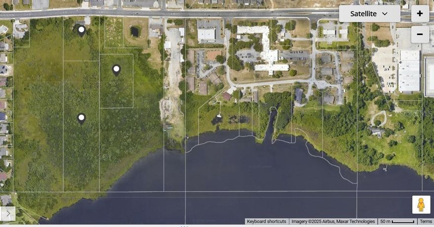 BACK ON THE MARKET.....Seller has replaced the roof on the commercial building.  UP AND COMING NEIGHBORHOOD with lots of shopping, homes and commercial offices.  Multi-purpose Commerical/Residential property centrally located on Dundee Rd in Winterhaven. 3 parcels total 10.98 acres. Used to be the home of Boss Hogg Radio.  Offers high visibility in a highly traveled intersection with excellent exposure directly on the highway.  Buildng is 2,004 sq ft. with a reception area, bathroom, kitchen and an office, along with a paved parking area.  Satellite is currently leased on a monthly basis @ $1500, and conveys.  The annual average daily traffic for this part of Dundee Road is approximately 16,000 cars/day!  This is a great opportunity to either use the existing building or make an addition and build your own.  Potential for restaurant, radio stations, professional offices & more.  Lot with building is commercial;  2 other lots are deemed residential. Land is cleared and improved.  Survey shows potential.  Stated for 8-10 residential units. 40 minutes from Walt Disney World, 20 minutes to Kissimmee, and 52 minutes to Orlando Int'l.