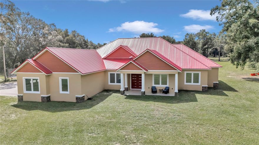 ***OWNER FINANCING AVAILABLE***Welcome home! Beautiful custom built home with 5 bedrooms and 3.5 bathrooms is a 3,538 sf one story single family home nestled in a 10.48 acres lot. Split floorplan with owner retreat in one side of the house and 4 bedrooms and 2 bath in the opposite side. When you walk through the 8' double front door you will be welcome to the foyer. Office space at the left hand side leading to the open living room/ kitchen/ dining room. Sliding door leads to the covered open back porch where you can barbecue and enjoy the beautiful view of the back yard. Kitchen featuring 42" cabinets with 12" tops for an elegant look. Massive kitchen island with stainless steel appliances complement the modern decoration style of this home. Large tile throughout the whole house makes seamless the transition from spaces. Large owners retreat with spacious walking closet and double sink vanities and shower leading to the laundry room. Towards the back of the property you will have a large workshop building with capacity for up to 12 vehicles. and plenty of space to enjoy gardening, walking or just simply go and have fun riding your four-wheeler around the property. Conveniently located with easy access to I75, restaurants, shopping's and much more. Hurry! Don't let this opportunity pass. This property will not last long in the market! Come an experience country living at it's best! ***OWNER FINANCING AVAILABLE***