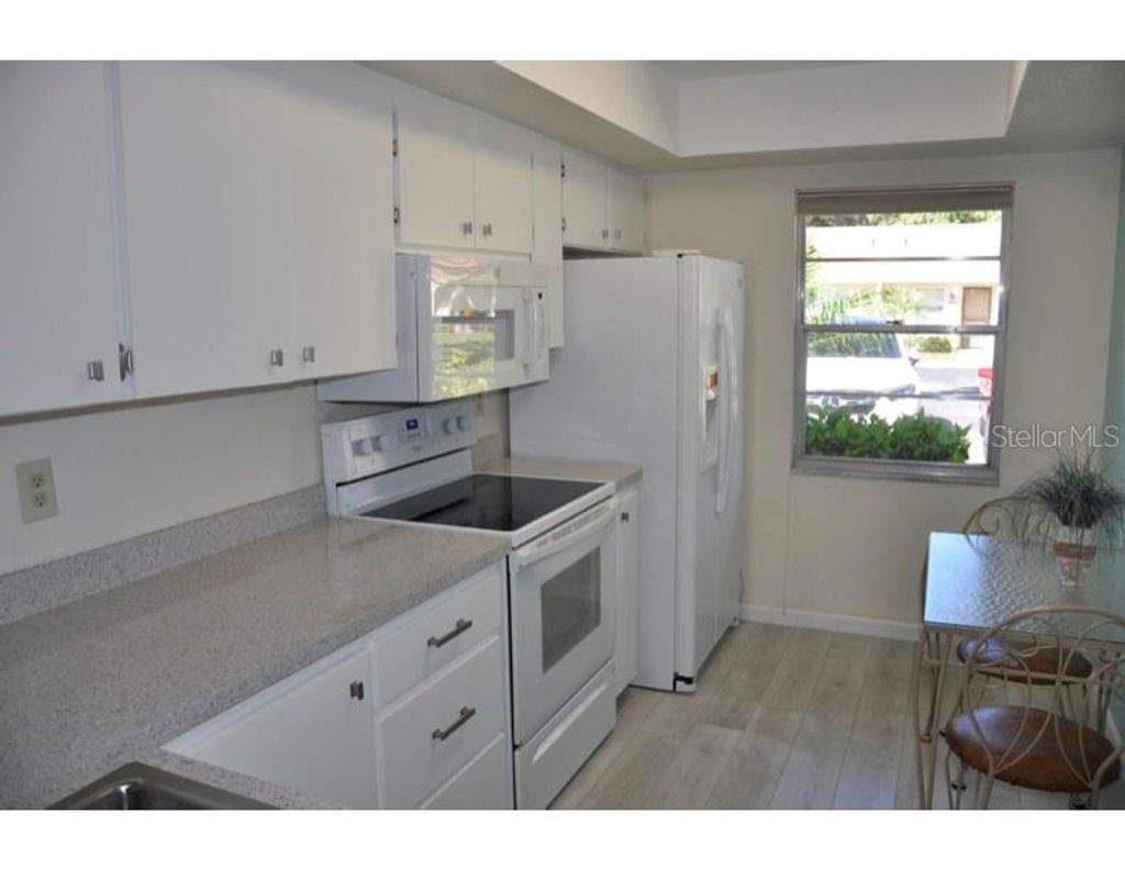 Photo of 2630 Woodgate Lane #G3, Sarasota, FL 34231 (MLS # TB8431315)