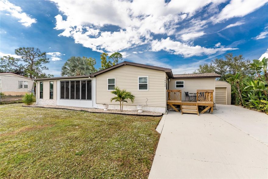 Pride in ownership shines in this updated and meticulously maintained 3 bedroom 2 bathroom home in Southwest Florida. This property is located just minutes from Historic Downtown Punta Gorda and sits on a peaceful fresh water canal. Enter the home off the adorable wood front porch into the living room with vaulted ceilings and includes the coastal living room set. Turn right and notice the water view through the sliding glass doors off the kitchen/dining room. The kitchen has lots of cabinets for storage space, granite counter tops, counter to ceiling tiled back splash and natural light for a Sola-Tube skylight. Also in the kitchen is a discreetly placed, stacked LG Washer and dryer. The dining room, open to the kitchen, comes complete with the table, chairs, bench seat, wall mirror and hutch. In fact seller is offing the property with the personal items you see within. The primary bedroom has a luxurious en-suite bathroom with tiled walk in shower with glass door and double vanity with Carrera marble top. This home has Vinyl plank flooring throughout and replacement windows.  Enjoy the sounds of native birds from the outdoor seating area in the spacious lanai looking out at the water. The oversized one car garage includes an additional refrigerator and would make a great workshop or storage space. This home is partially furnished, super clean, updated and well maintained. Seller offering a home warranty for buyers peace of mind. Come see this property today!