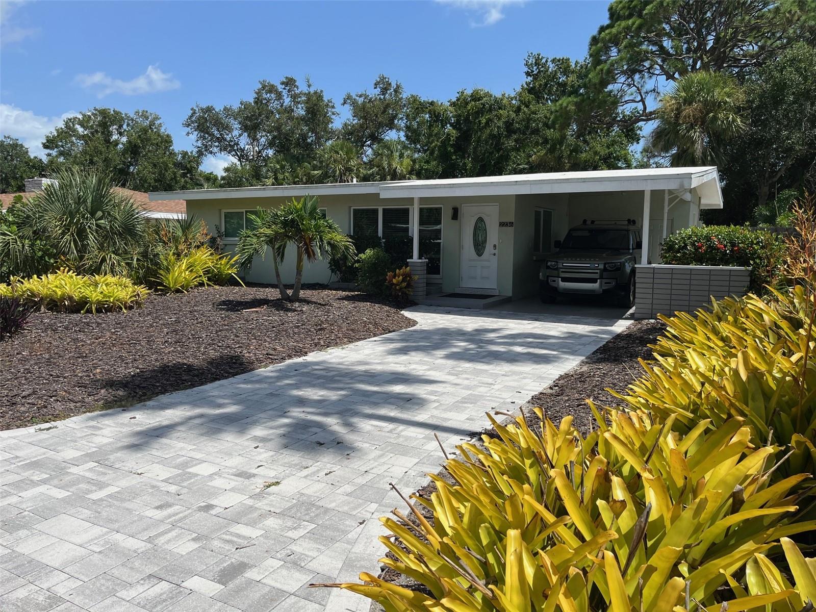 Totally renovated and move-in ready 2 BR / 2BA tru mid-century modern home, open concept design with vaulted ceilings exposed beams, hurricane impact low-E windows and doors, professionally restored terrazzo floors throughout, re-stuccoed exterior block construction with freshly painted exterior and interior and paver driveway. New elastomeric roof coating, shaker style kitchen cabinets with soft-close doors and solid plywood boxes, large peninsula, marble countertops, updated bathrooms, master bedroom with en-suite and walk-in cedar closet, two additional cedar closets, air-conditioned laundry room, LED lighting throughout, home security and fire alarm equipment, bonus room with slanted modern wall of windows that can be used for dining room or sunroom. Large lot (7430 sq.ft.), with fully fenced back yard, large (new) paver patio area, grass lawn and irrigation system, mature trees for shade and new Tuff Shed for storage and tools. This is a very low maintenance home with underground power lines located in a VERY high sought after area just two miles south of downtown... minutes from restaurants, shopping, Bay Park, Siesta Key and St. Armand's Circle. **"Seller is Licensed FL Real Estate Agent".
