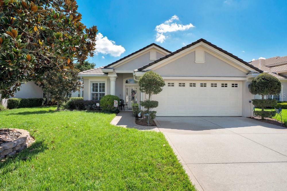 Experience refined living in this exquisitely remodeled residence within the highly sought after Grasslands Golf & Country Club community. This beautifully renovated 2-bedroom, 2-bathroom home, with an additional flex space (ideal for a study, fitness room, or third bedroom), offers nearly 2,200 square feet of sophisticated design and modern convenience.
Recently refreshed with a professionally painted exterior (September 2025), the home showcases interiors adorned with custom solid wood Amish cabinetry, elegant finishes, and a cohesive aesthetic curated by the impressive taste of this discerning seller. The open-concept floor plan unites the kitchen, dining, and living spaces in a graceful flow, ideal for both intimate evenings and lively gatherings.
The primary suite is a sanctuary unto itself, featuring a spa-inspired bathroom with a soaking tub, dual vanities, and a spacious walk-in shower. A second bedroom and the versatile flex room offer ample accommodations for guests or work-from-home needs.
Outdoors, the extended screened-in porch provides a tranquil retreat with picturesque views of the pond and fountain. Even the garage reflects thoughtful planning with a cedar-lined storage closet offering both function while keeping belongings fresh and organized.
Within this gated, maintenance-free oasis, residents enjoy championship golf, round-the-clock security, and an unrivaled lifestyle of convenience and leisure. Perfectly positioned, the property affords enviable proximity to Lakeland’s cultural and recreational gems: the serene beauty of Lake Hollingsworth, the vibrant energy of Downtown, the upscale allure of Lakeside Village Mall, and an array of restaurants and entertainment venues. Seamless access to the Polk Parkway ensures effortless commutes to both Orlando and Tampa, making this an address of true distinction.